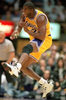 30 Jan 1996: Magic Johnson #32 of the Los Angeles Lakers celebrates on the court during his first game back as a Laker at the Great Western Forum in Inglewood, California.   Mandatory Credit: Allsport  /Allsport