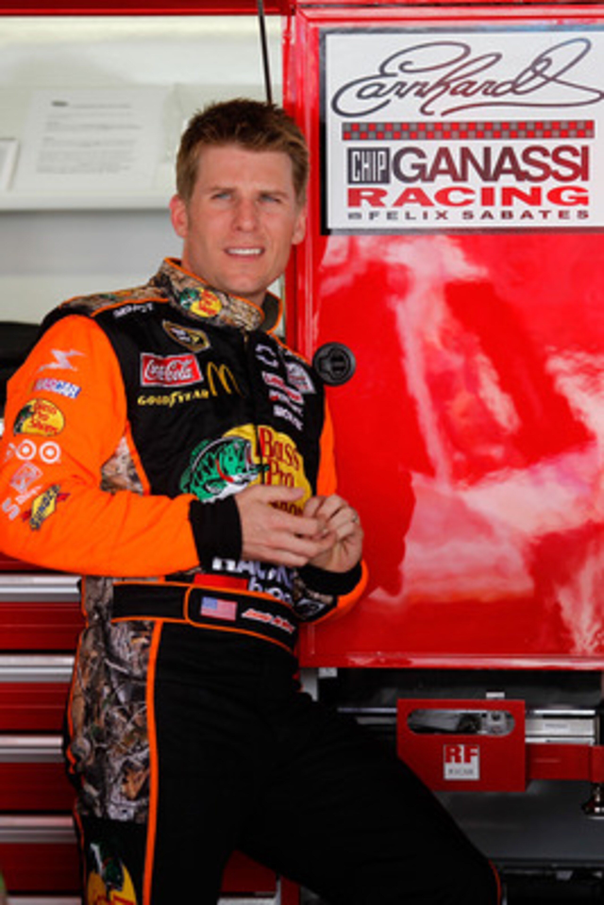 DOVER, DE - MAY 13:  Jamie McMurray, driver of the #1 Bass Pro Shops/Tracker Chevrolet, stands in the garage during practice for the NASCAR Sprint Cup Series FedEx 400 Benefiting Autism Speaks at Dover International Speedway on May 13, 2011 in Dover, Dela