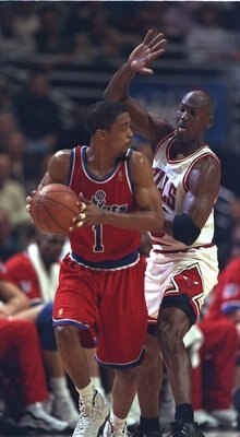 25 Apr 1997:  Rod Strickland of the Washington Bullets runs from Michael Jordan of the Chicago Bulls during their 98-86 loss to the Bulls in the NBA first round playoffs at United Center in Chicago, Illinois.  Mandatory Credit: Jonathan Daniel  /Allsport
