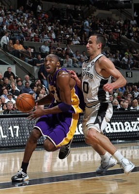 SAN ANTONIO - MARCH 24:  Guard Kobe Bryant #24 of the Los Angeles Lakers dribbles the ball past Manu Ginobili #20 of the San Antonio Spurs at AT&T Center on March 24, 2010 in San Antonio, Texas.  NOTE TO USER: User expressly acknowledges and agrees that,