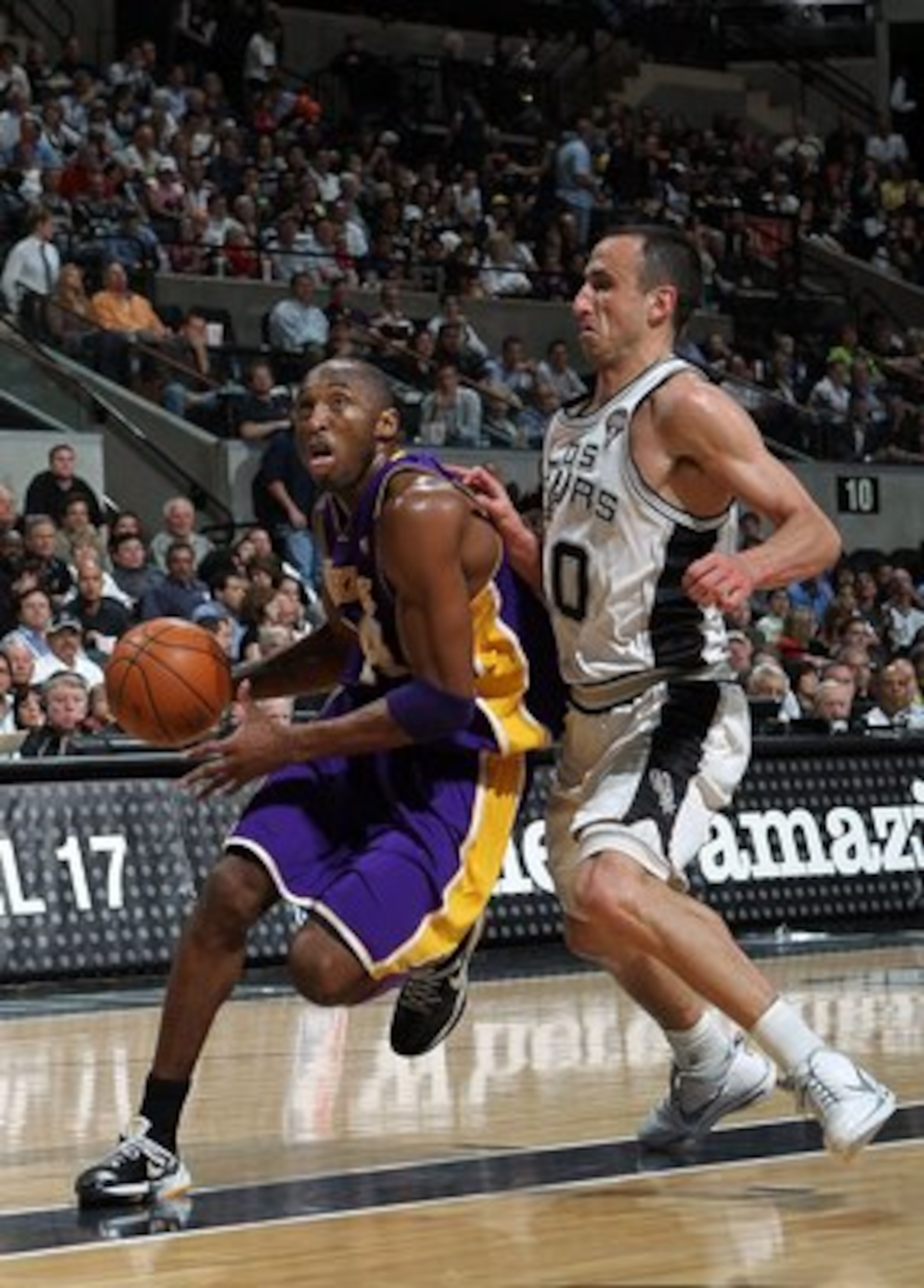 SAN ANTONIO - MARCH 24: Guard Kobe Bryant #24 of the Los Angeles Lakers dribbles the ball past Manu Ginobili #20 of the San Antonio Spurs at AT&T Center on March 24, 2010 in San Antonio, Texas. NOTE TO USER: User expressly acknowledges and agrees that, SAN ANTONIO - MARCH 24: Guard Kobe Bryant #24 of the Los Angeles Lakers dribbles the ball past Manu Ginobili #20 of the San Antonio Spurs at AT&T Center on March 24, 2010 in San Antonio, Texas. NOTE TO USER: User expressly acknowledges and agrees that,