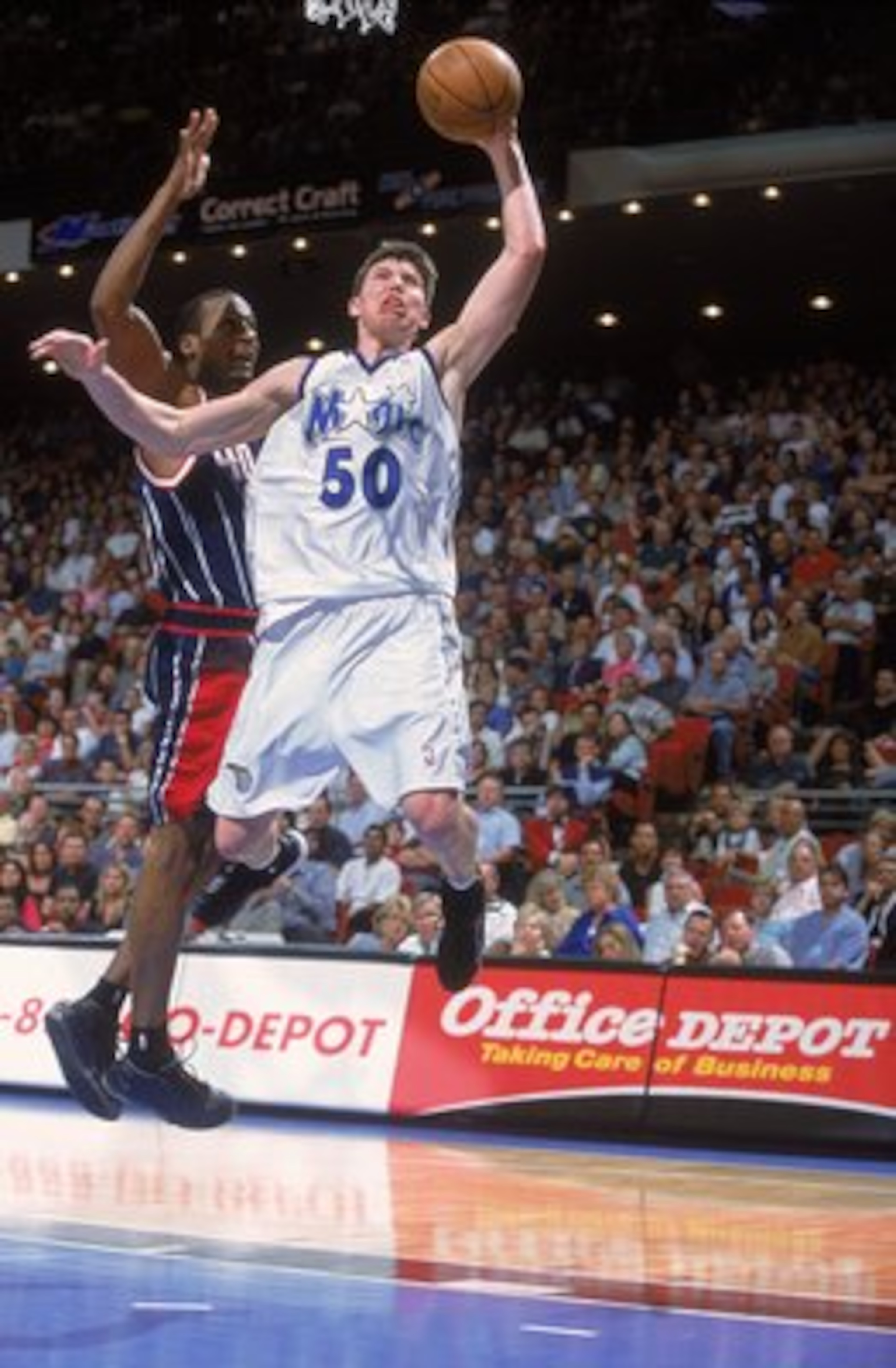 16 Feb 2001:  Mike Miller #50 of the Orlando Magic leaps for the basket during the game against the Houston Rockets at the Compaq Center in Houston, Texas.  The Magic defeated the Rockets 108-93.  NOTE TO USER: It is expressly understood that the only rig