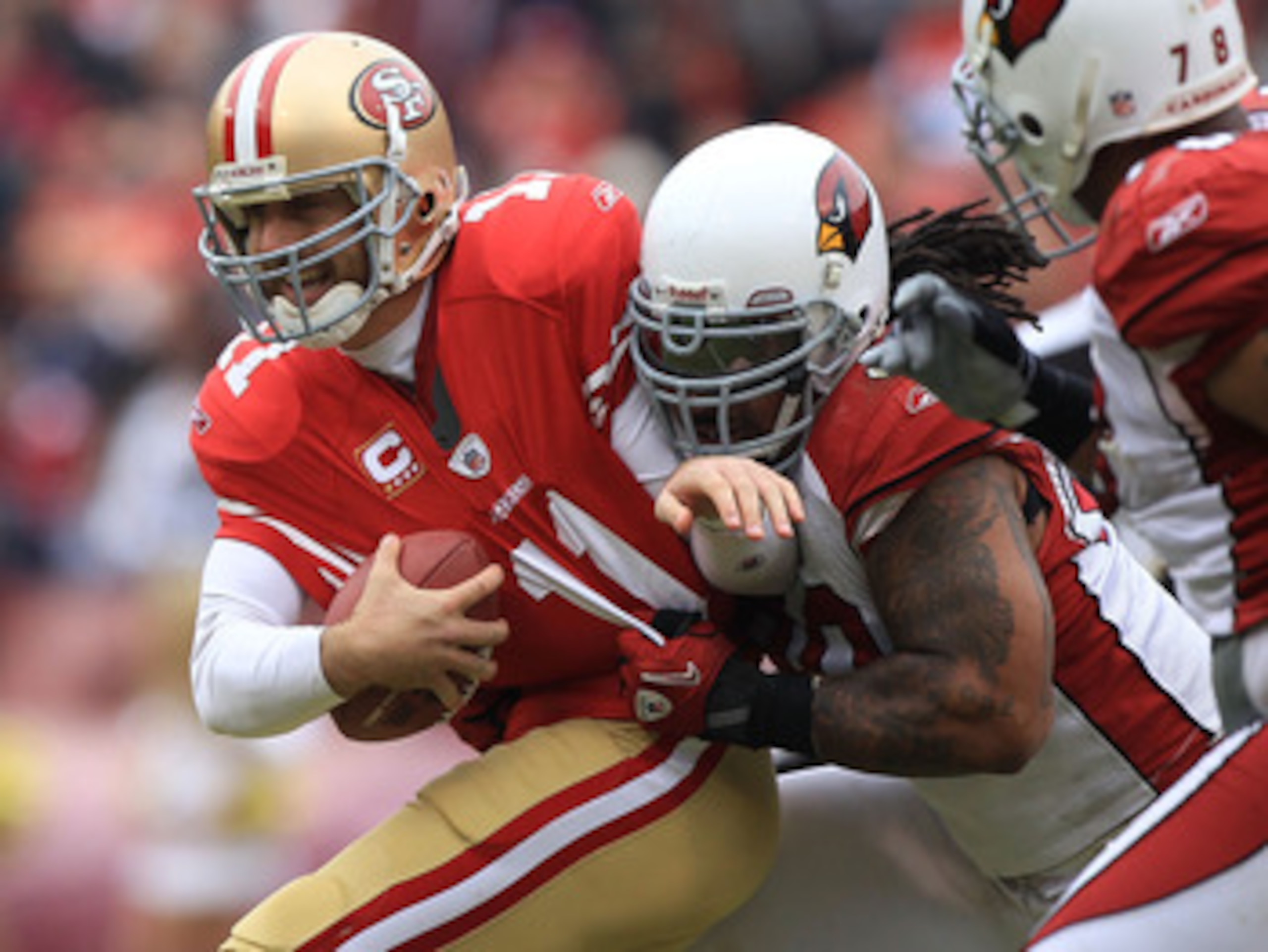 SAN FRANCISCO, CA - JANUARY 02: Alex Smith #11 of the San Francisco 49ers is sacked by Darnell Dockett #90 of the Arizona Cardinals during an NFL game at Candlestick Park on January 2, 2011 in San Francisco, California. (Photo by Jed Jacobsohn/Getty I SAN FRANCISCO, CA - JANUARY 02: Alex Smith #11 of the San Francisco 49ers is sacked by Darnell Dockett #90 of the Arizona Cardinals during an NFL game at Candlestick Park on January 2, 2011 in San Francisco, California. (Photo by Jed Jacobsohn/Getty I