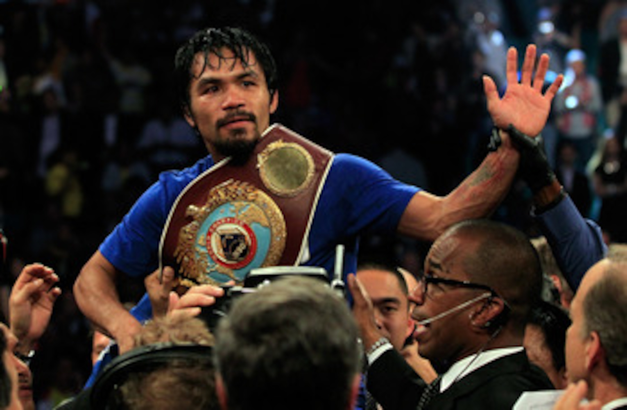 LAS VEGAS, NV - MAY 07:  Manny Pacquiao of the Philippines celebrates after his unanimous decision victory against Shane Mosley in the WBO welterweight title fight at MGM Grand Garden Arena on May 7, 2011 in Las Vegas, Nevada.  (Photo by Chris Trotman/Get