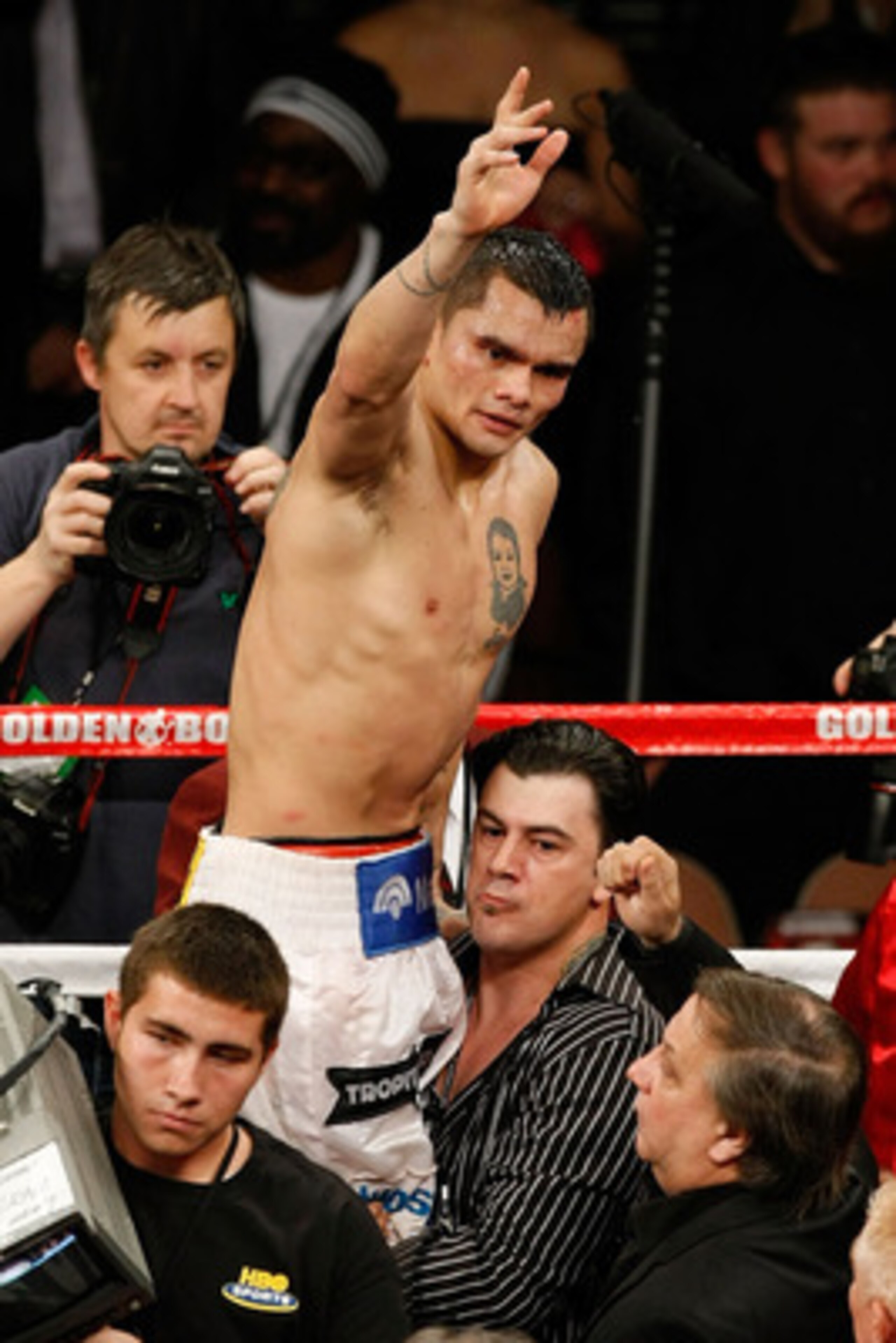 LAS VEGAS - DECEMBER 11:  Marcos Maidana of Argentina is lifted up by Sebastian Contursi after Maidana was defeated by Amir Khan of England by unanimous decision in their WBA super lightweight title fight at Mandalay Bay Events Center on December 11, 2010