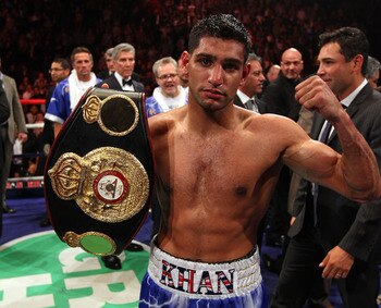 MANCHESTER, ENGLAND - APRIL 16:  Amir Khan celebrates after victory over Paul McCloskey in the WBA Light-Welterweight Championship fight between Amir Khan and Paul McCloskey at MEN Arena on April 16, 2011 in Manchester, England.  (Photo by Alex Livesey/Ge