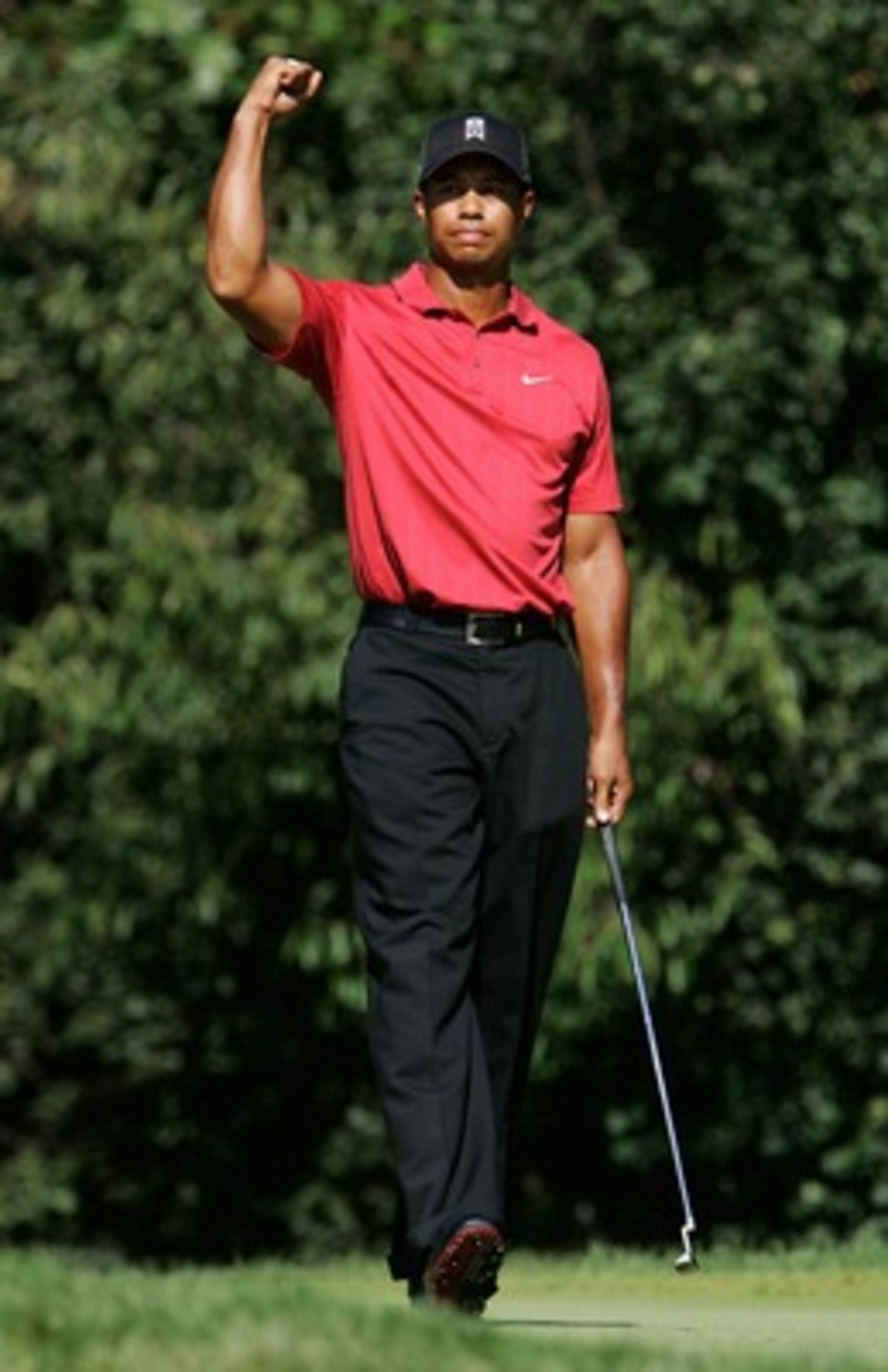 LEMONT, IL - SEPTEMBER 9:  Tiger Woods pumps his fist after making a birdie putt on the 12th hole during the final round of BMW Championship, the third event of the new PGA TOUR Playoffs for the FedExCup at Cog Hill Golf and Country Club September 9, 2007