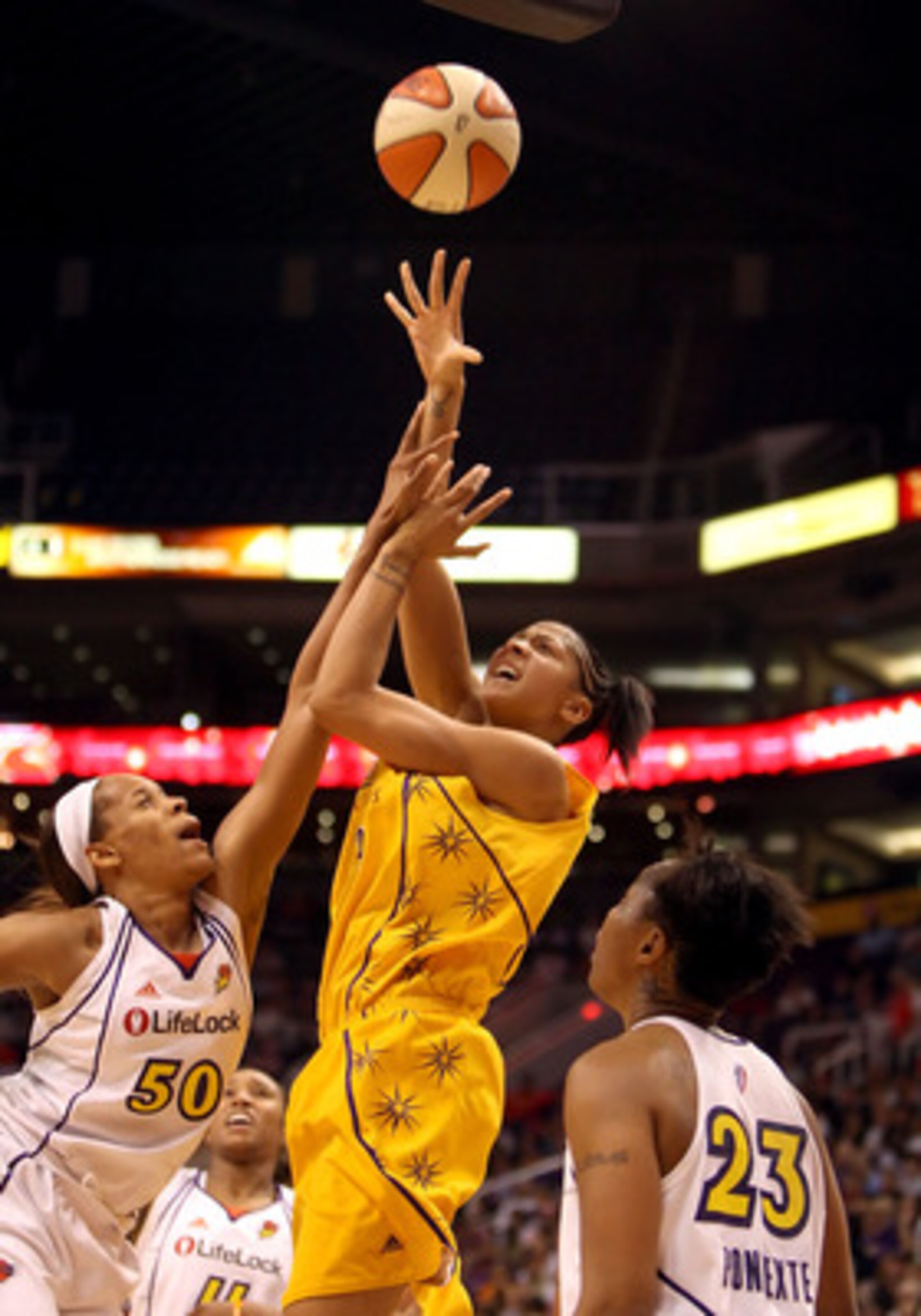 PHOENIX - SEPTEMBER 25:  Candace Parker #3 of the Los Angeles Sparks puts up a shot over Tangela Smith #50 and Cappie Pondexter #23 of the Phoenix Mercury in Game Two of the Western Conference Finals during the 2009 WNBA Playoffs at US Airways Center on A