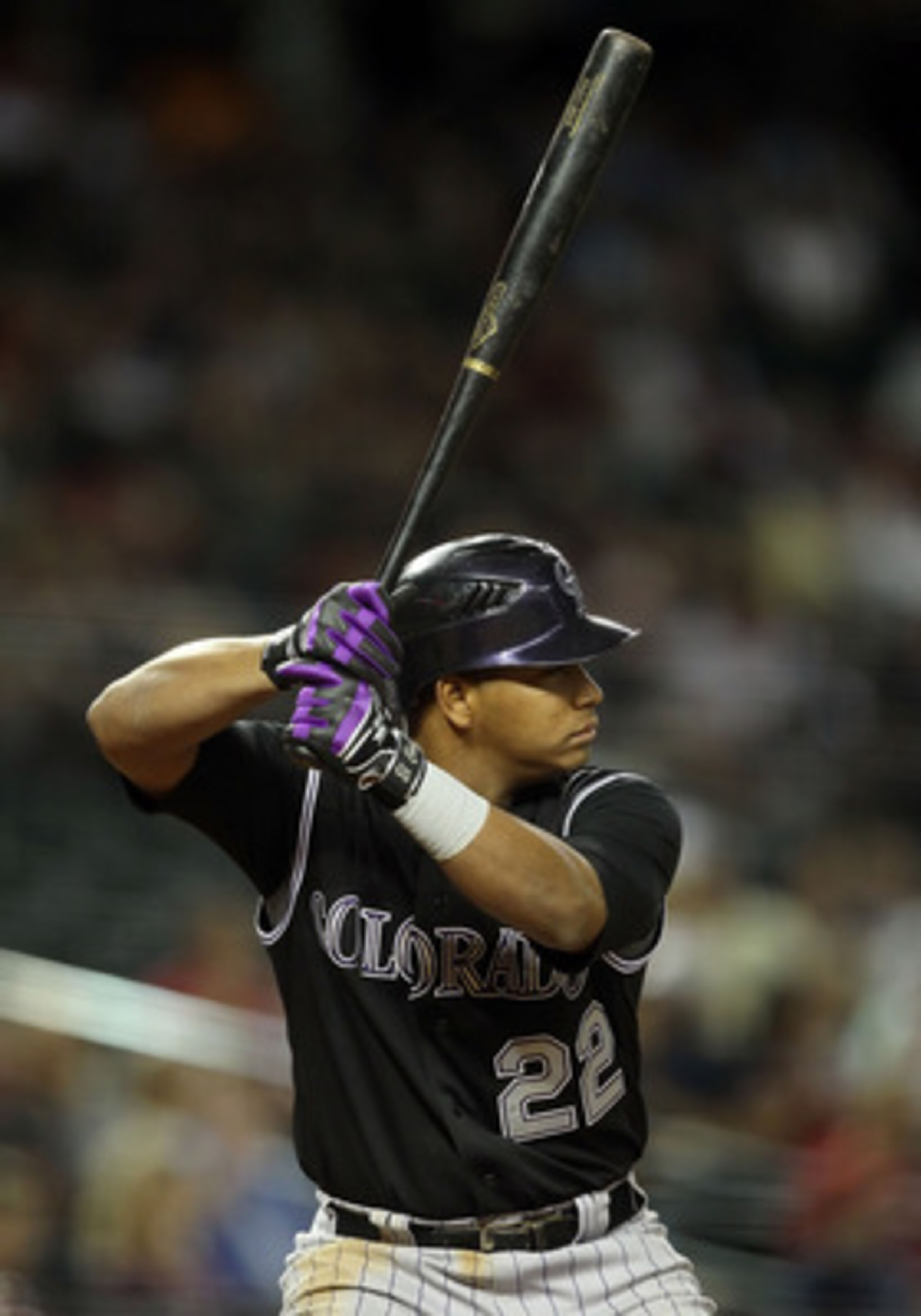 PHOENIX, AZ - MAY 03:  Jose Lopez #22 of the Colorado Rockies bats against the Arizona Diamondbacks during the Major League Baseball game at Chase Field on May 3, 2011 in Phoenix, Arizona.  The Diamondbacks defeated the Rockies 4-3.  (Photo by Christian P