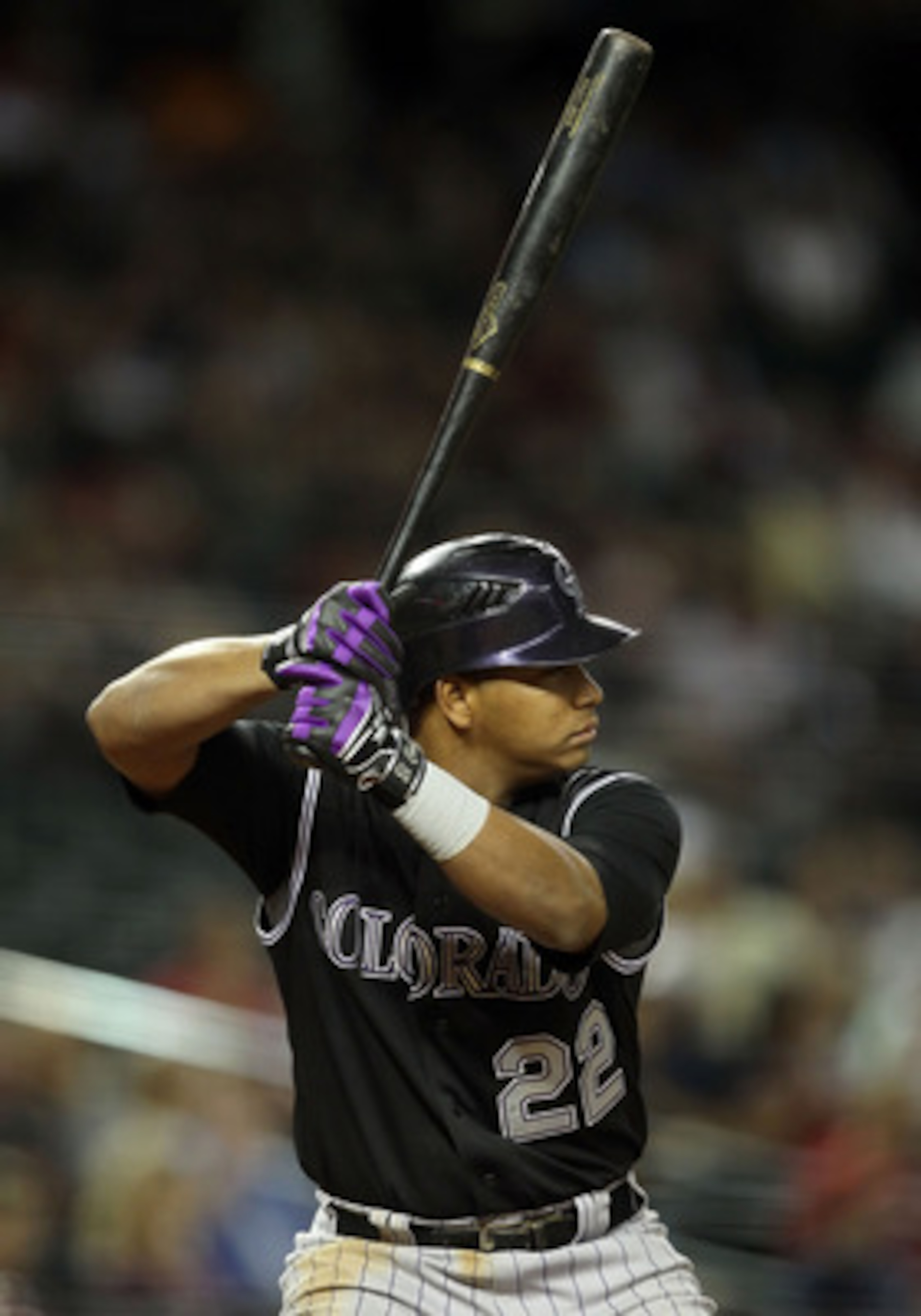 PHOENIX, AZ - MAY 03:  Jose Lopez #22 of the Colorado Rockies bats against the Arizona Diamondbacks during the Major League Baseball game at Chase Field on May 3, 2011 in Phoenix, Arizona.  The Diamondbacks defeated the Rockies 4-3.  (Photo by Christian P