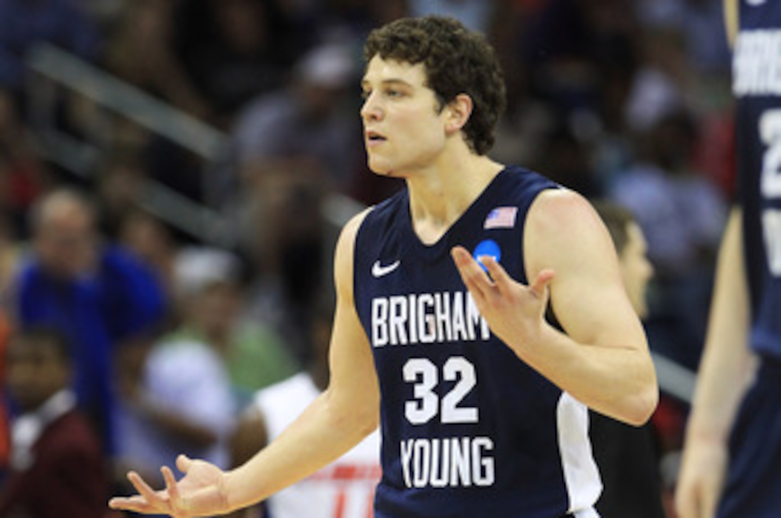 NEW ORLEANS, LA - MARCH 24:  Jimmer Fredette #32 of the Brigham Young Cougars reacts after being injured during their game against the Florida Gators in the Southeast regional of the 2011 NCAA men's basketball tournament at New Orleans Arena on March 24,