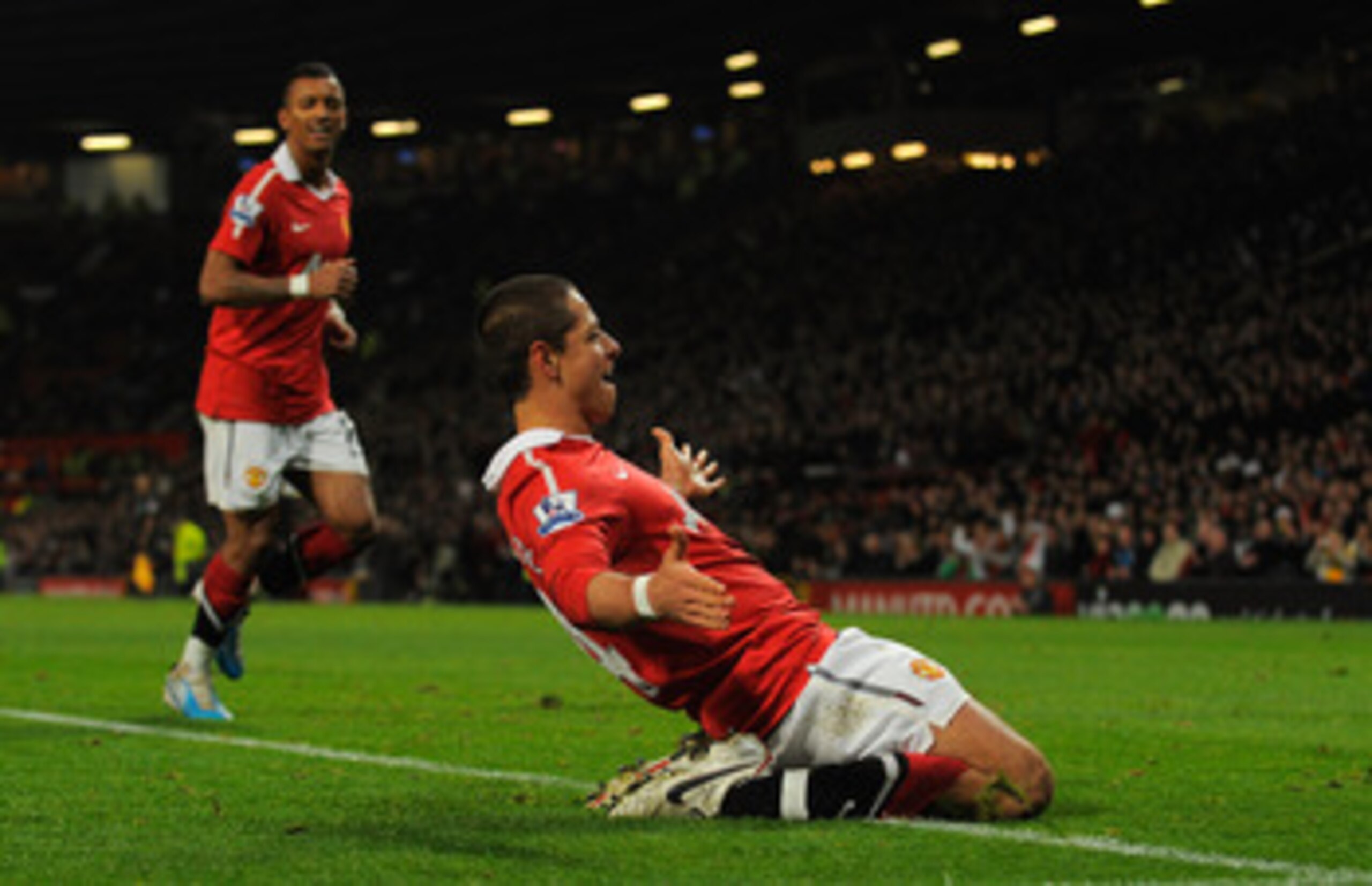 MANCHESTER, ENGLAND - NOVEMBER 20:  Javier Hernandez of Manchester United celebrates scoring to make it 2-0 with Nani during the Barclays Premier League match between Manchester United and Wigan Athletic at Old Trafford on November 20, 2010 in Manchester,
