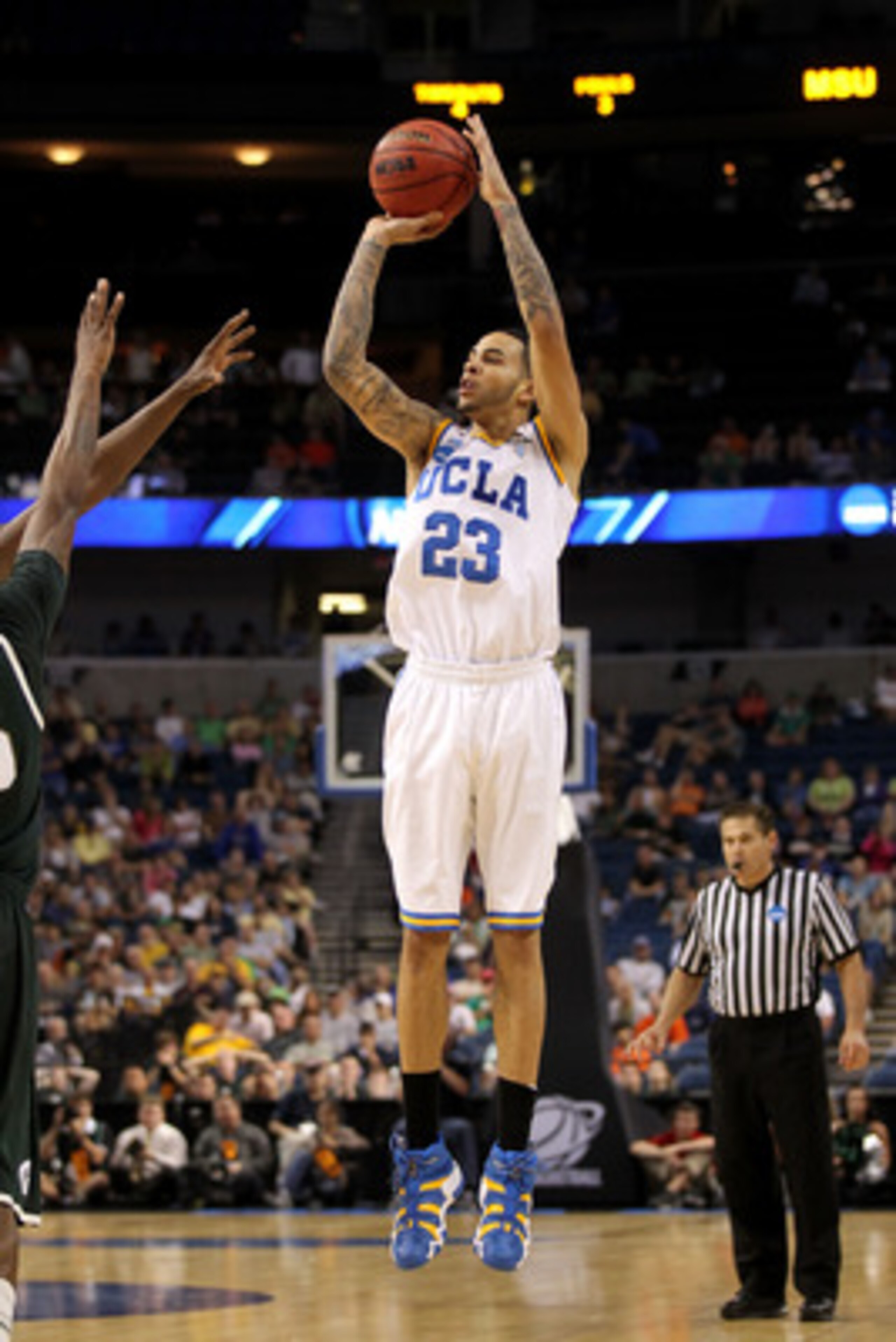 TAMPA, FL - MARCH 17:  Tyler Honeycutt #23 of the UCLA Bruins attempts a shot against the Michigan State Spartans during the second round of the 2011 NCAA men's basketball tournament at St. Pete Times Forum on March 17, 2011 in Tampa, Florida. UCLA won 78
