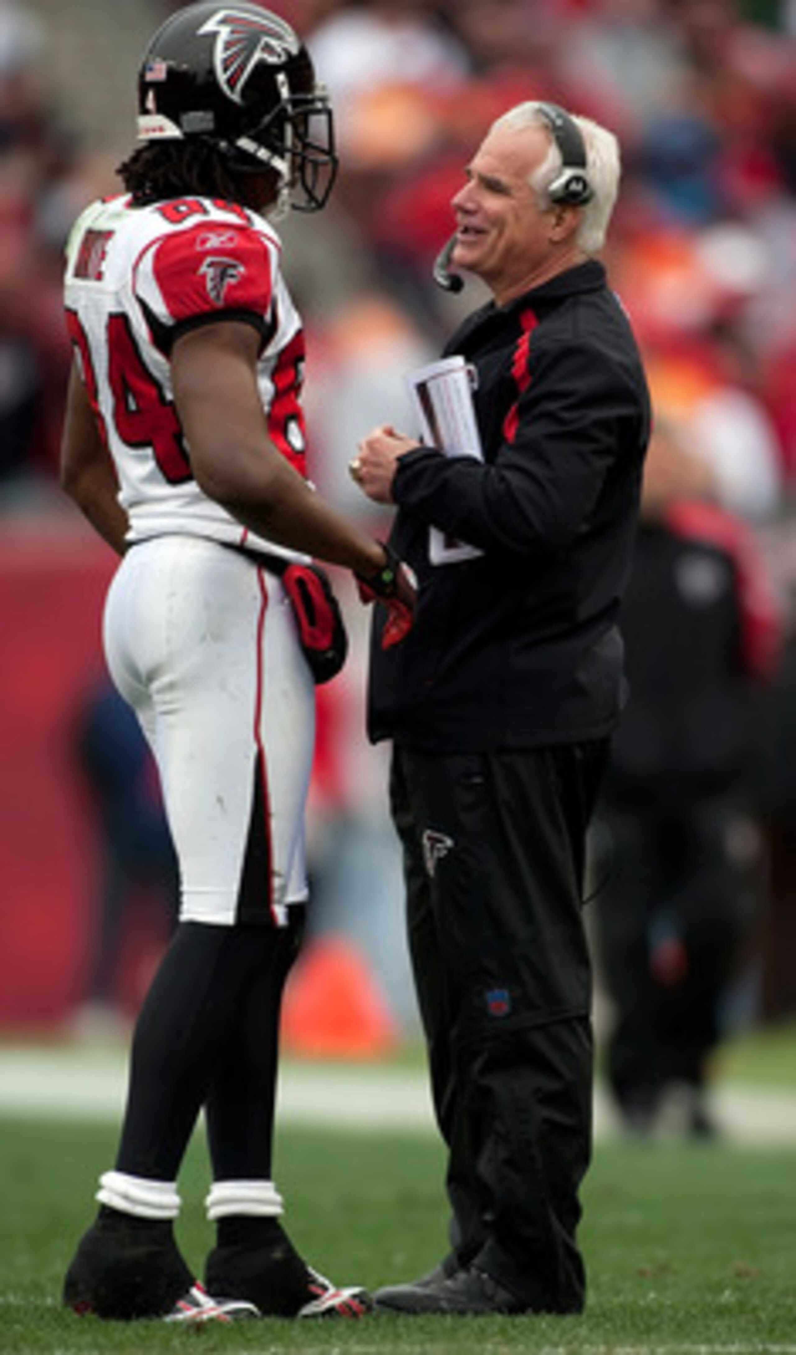 TAMPA, FL - JANUARY 03:  Head coach Mike Smith talks with receiver Roddy White #84 of the Atlanta Falcons during the game against the Tampa Bay Buccaneers at Raymond James Stadium on January 3, 2010 in Tampa, Florida.  (Photo by J. Meric/Getty Images)