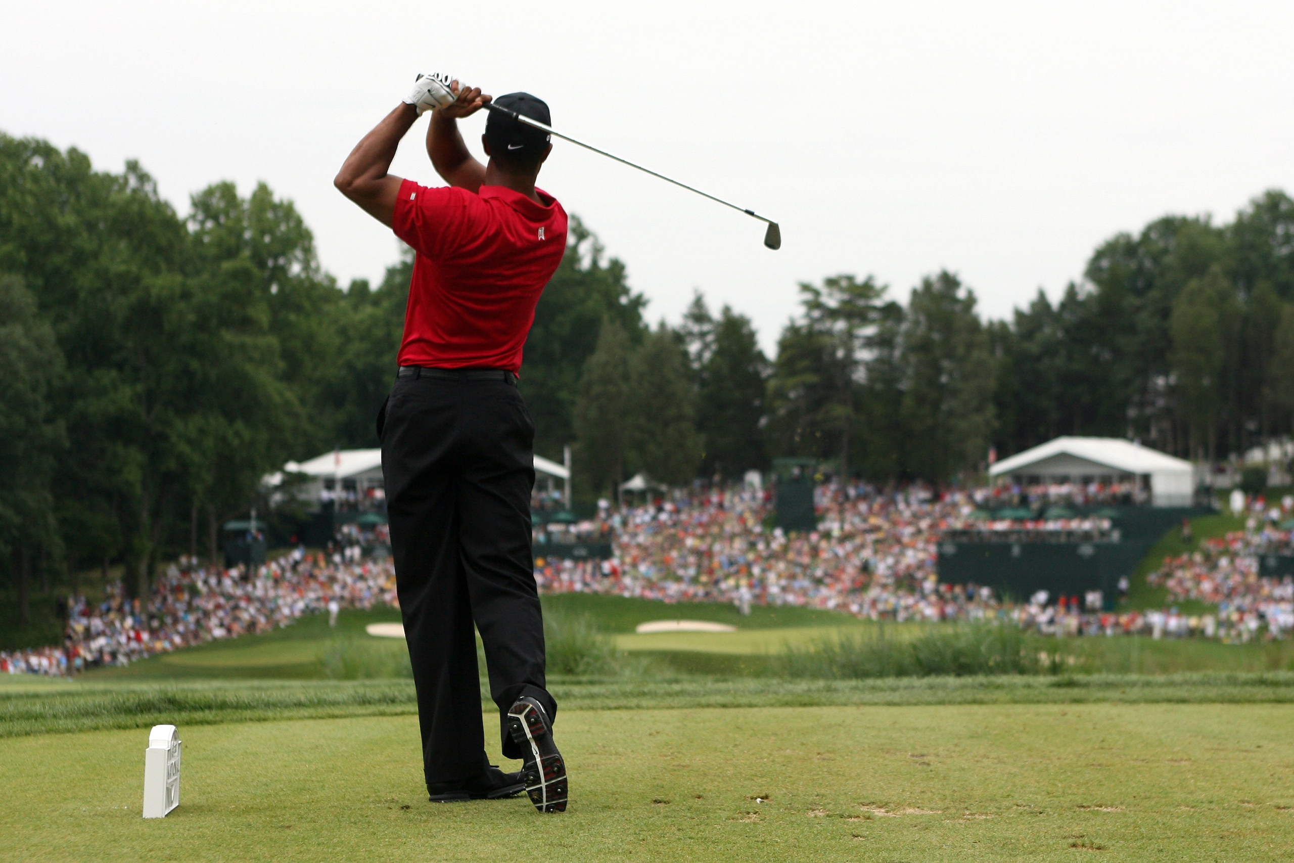 BETHESDA, MD - JULY 05:  Tiger Woods hits a shot during the final round of the AT&T National hosted by Tiger Woods at Congressional Country Club on July 5, 2009 in Bethesda, Maryland.  (Photo by Hunter Martin/Getty Images)
