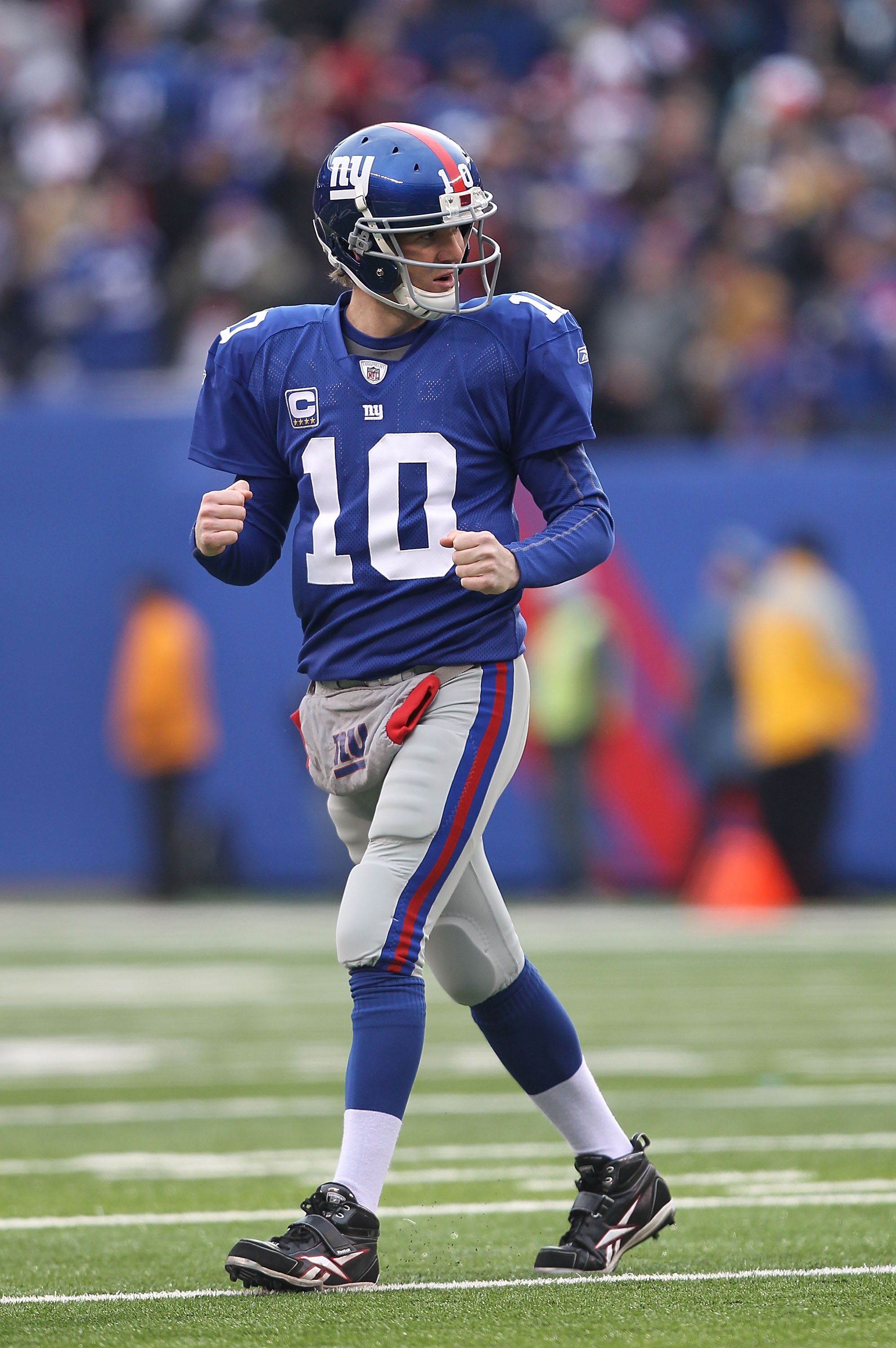 EAST RUTHERFORD, NJ - DECEMBER 19:  Eli Manning #10 of the New York Giants celebrates a touchdown by Mario Manningham during their game against the Philadelphia Eagles on December 19, 2010 at The New Meadowlands Stadium in East Rutherford, New Jersey.  (P