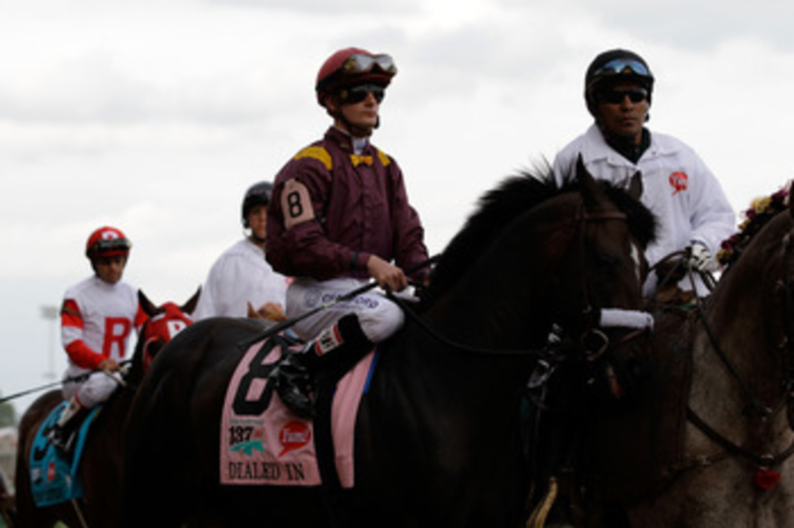 LOUISVILLE, KY - MAY 07:  Jockey Julien R. Leparoux, riding Dialed In #8, is escourted onto the track for the running of the 137th Kentucky Derby at Churchill Downs on May 7, 2011 in Louisville, Kentucky.  (Photo by Rob Carr/Getty Images)