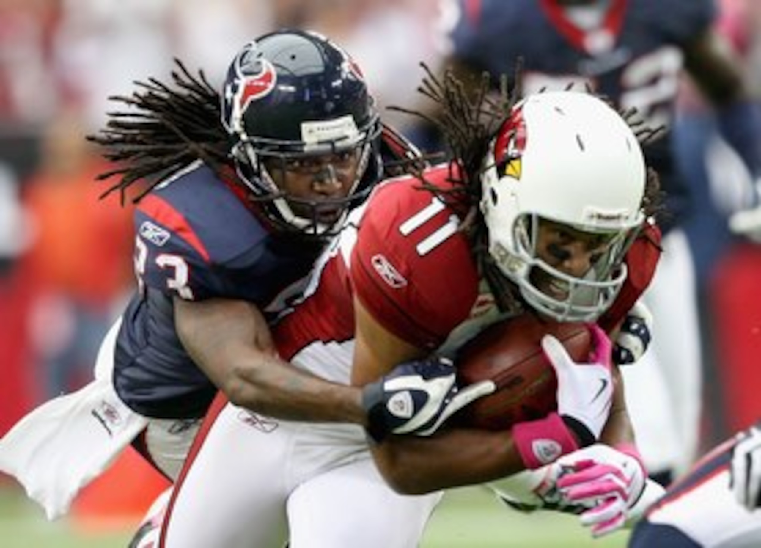 GLENDALE, AZ - OCTOBER 11: Cornerback Dunta Robinson #23 of the Houston Texans tackles Larry Fitzgerald #11 of the Arizona Cardinals during the NFL game at the Universtity of Phoenix Stadium on October 11, 2009 in Glendale, Arizona. The Cardinals defeat GLENDALE, AZ - OCTOBER 11: Cornerback Dunta Robinson #23 of the Houston Texans tackles Larry Fitzgerald #11 of the Arizona Cardinals during the NFL game at the Universtity of Phoenix Stadium on October 11, 2009 in Glendale, Arizona. The Cardinals defeat