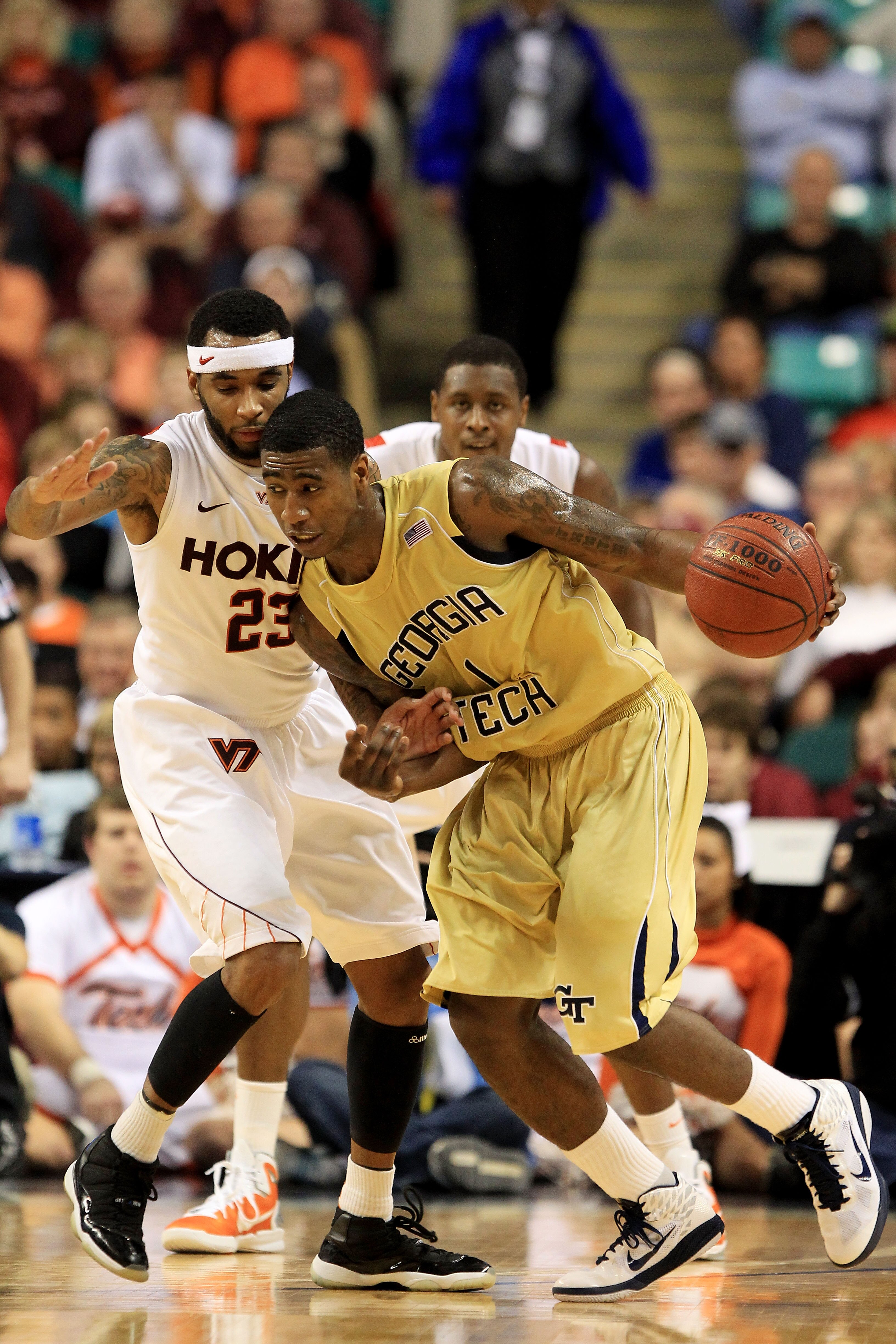 GREENSBORO, NC - MARCH 10:  Iman Shumpert #1 of the Georgia Tech Yellow Jackets drives against Malcolm Delaney #23 of the Virginia Tech Hokies during the first half of the game in the first round of the 2011 ACC men's basketball tournament at the Greensbo
