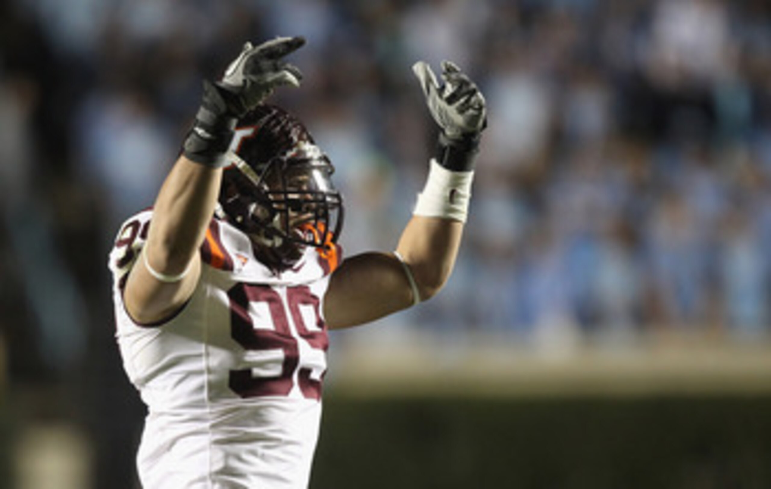 CHAPEL HILL, NC - NOVEMBER 13:  James Gayle #99 of the Virginia Tech Hokies celebrates after a sack against the North Carolina Tar Heels during their game at Kenan Stadium on November 13, 2010 in Chapel Hill, North Carolina.  (Photo by Streeter Lecka/Gett