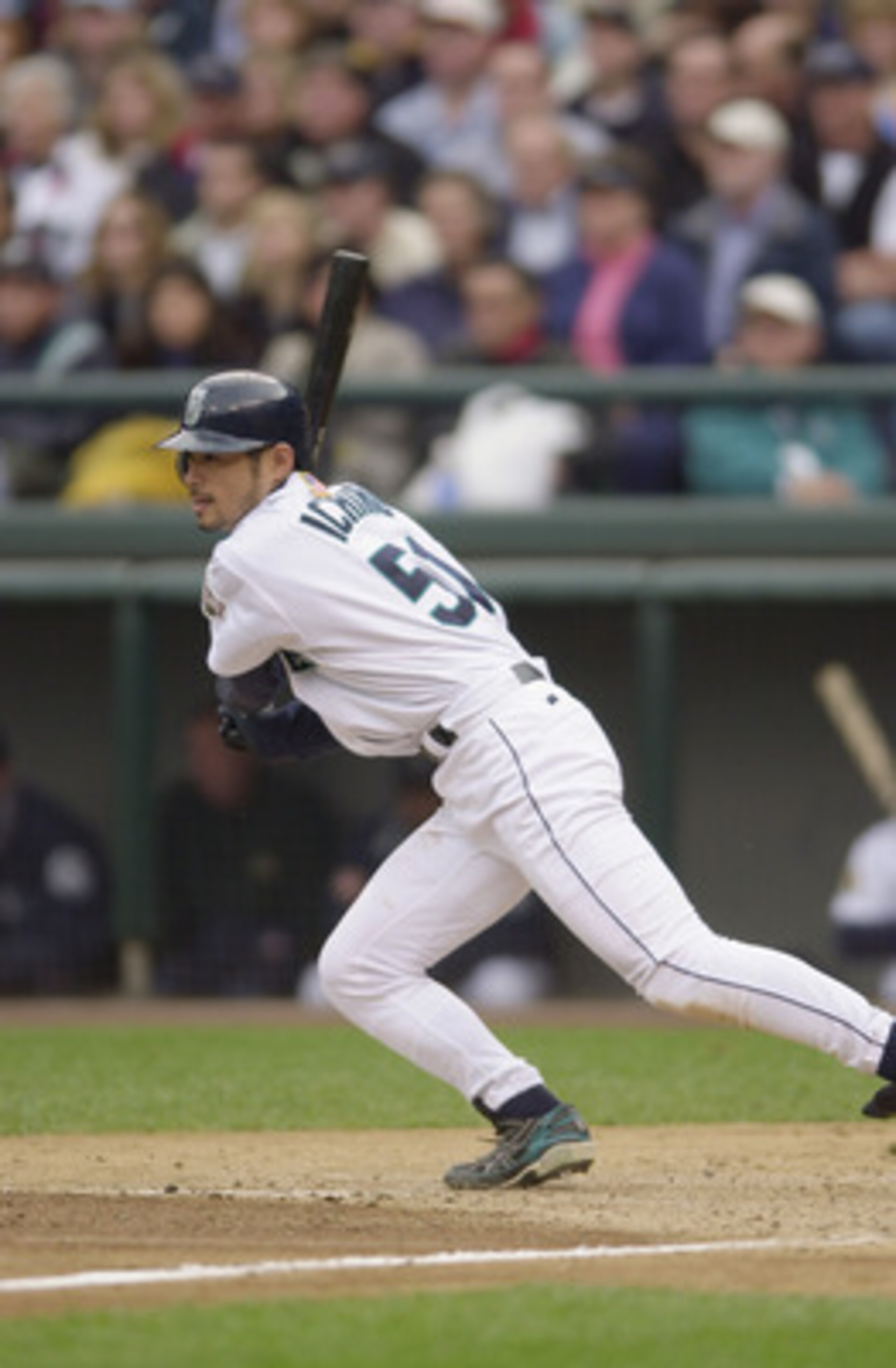 SEATTLE - OCTOBER 15:  Ichiro Suzuki #52 of the Seattle Mariners makes his way to first base during Game 2 of the American League Division Series against the Cleveland Indians on October 15, 2001 at Safeco Field in Seattle, Washington.  The Mariners won 5
