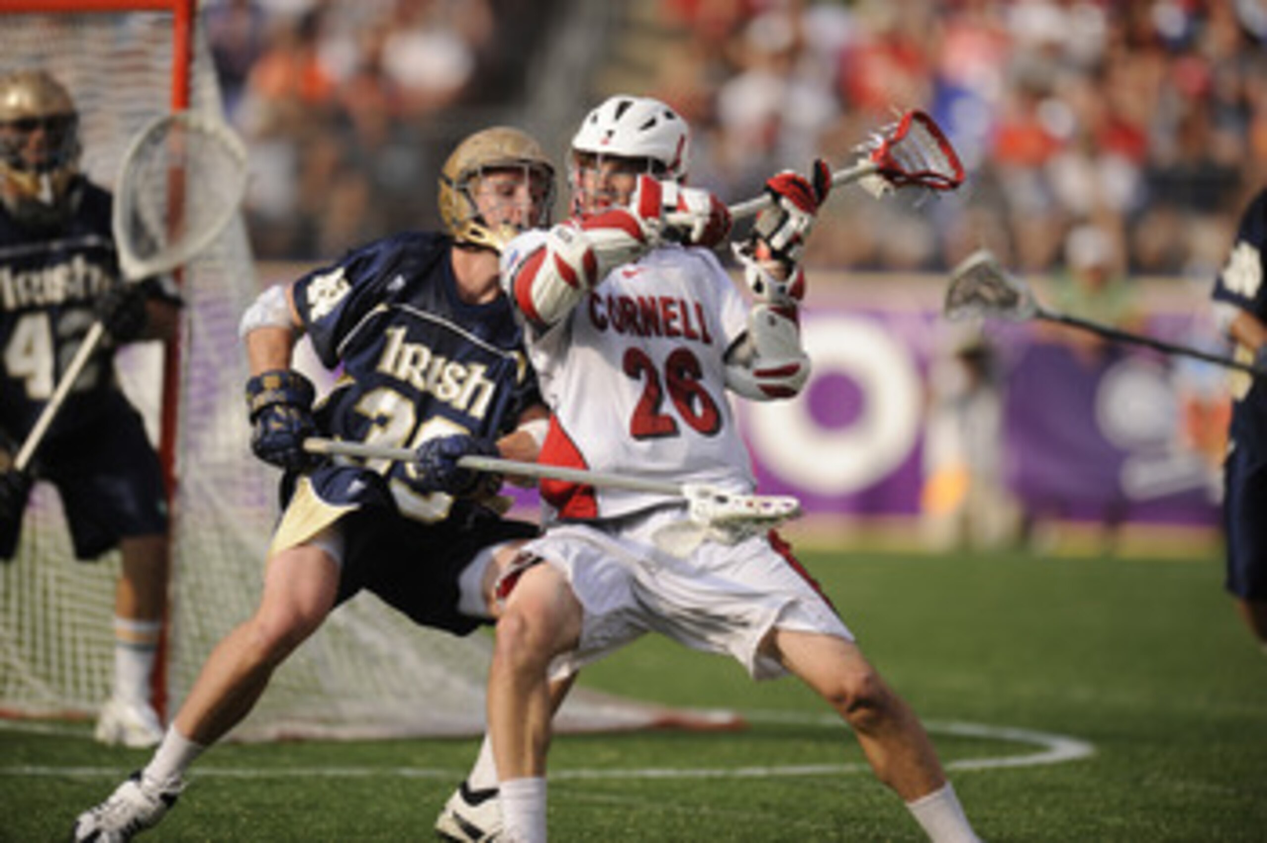 BALTIMORE, MD - MAY 29:  Ryan Hurley #26 of the Cornell Big Red tries to get a pass off against Kevin Randell #39 of the Notre Dame Fighting Irish during the 2010 NCAA Division 1 Lacrosse Semifinal Championship game on May 29, 2010 at M & T Bank Stadium i