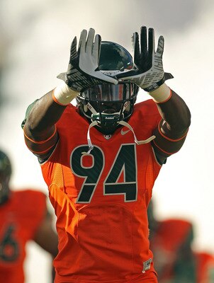 MIAMI - NOVEMBER 20: Kelvin Cain #94 of the Miami Hurricanes throws up the 'U' during a game against the Virginia Tech Hokies at Sun Life Stadium on November 20, 2010 in Miami, Florida.  (Photo by Mike Ehrmann/Getty Images)