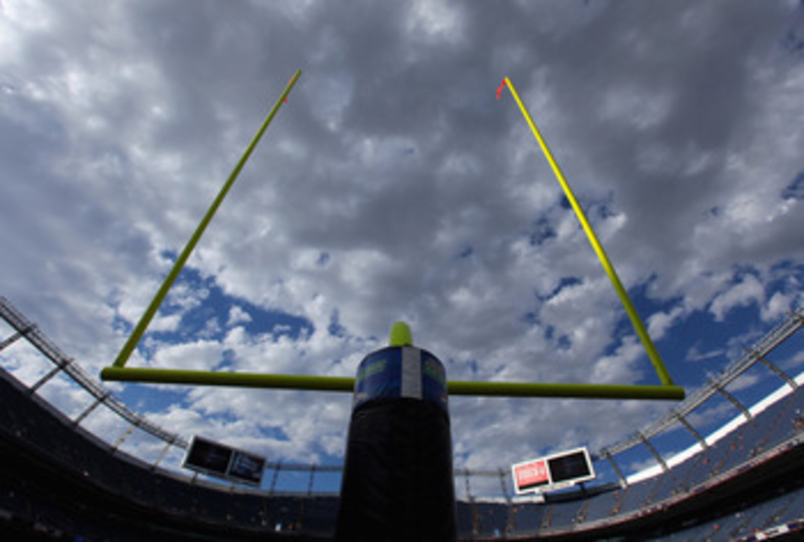 DENVER - AUGUST 21:  The goal posts on the south end of the field aim skyward as clouds filter the fading sun as the Denver Broncos host the Detroit Lions during preseason NFL action at INVESCO Field at Mile High on August 21, 2010 in Denver, Colorado.  (