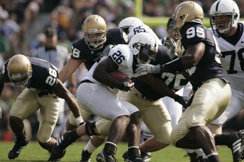 SOUTH BEND, IN - SEPTEMBER 9:  Tailback Tony Hunt #26 of the Penn State Nittany Lions runs the ball against the Notre Dame Fighting Irish defense during the game on September 9, 2006 at Notre Dame Stadium in South Bend, Indiana. (Photo By Gregory Shamus/G
