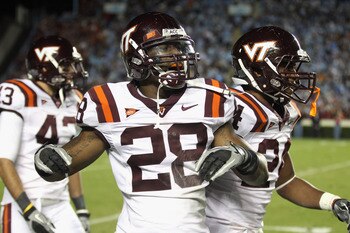 CHAPEL HILL, NC - NOVEMBER 13:  Alonzo Tweedy #28 of the Virginia Tech Hokies celebrates with teammates after recovering a fumble against the North Carolina Tar Heels during their game at Kenan Stadium on November 13, 2010 in Chapel Hill, North Carolina. 