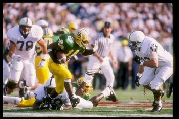 2 Jan 1995:  Tailback Ricky Whittle of the Oregon Ducks tries to break a tackle during the Rose Bowl against the Penn State Nittany Lions at the Rose Bowl in Pasadena, California.  Penn State won the game 38-20. Mandatory Credit: Mike Powell  /Allsport