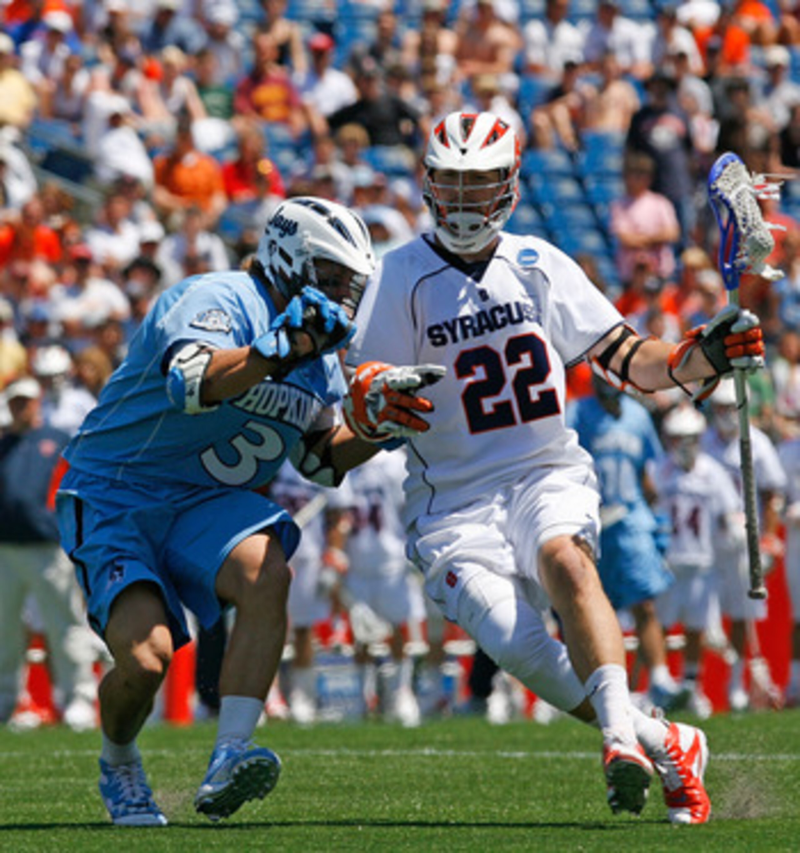 FOXBORO, MA - MAY 26:  Dan Hardy #22 of the Syracuse Orange drives against Andrew Miller #3 of the Johns Hopkins Blue Jays during the NCAA Lacrosse Championship at Gillette Stadium on May 26, 2008 in Foxboro, Massachusetts. Hardy scored three goals in the