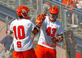 FOXBOROUGH, MA - MAY 25: Kenny Nims #10 scores the tying goal and celebrates with Cody Jamieson #43 of the Syracuse Orange, who would later score the winning goal in overtime to defeat the Cornell Big Red, 10-9, in overtime for NCAA Division I Lacrosse C FOXBOROUGH, MA - MAY 25: Kenny Nims #10 scores the tying goal and celebrates with Cody Jamieson #43 of the Syracuse Orange, who would later score the winning goal in overtime to defeat the Cornell Big Red, 10-9, in overtime for NCAA Division I Lacrosse C