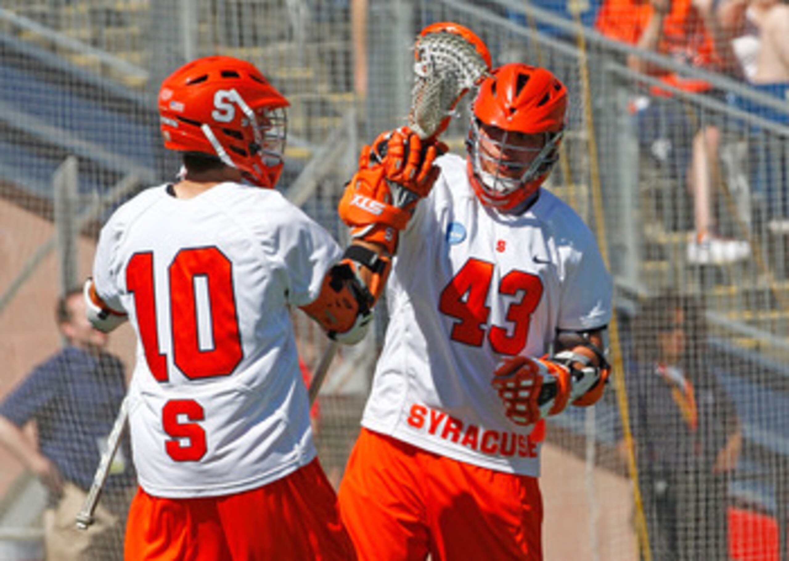 FOXBOROUGH, MA - MAY 25:  Kenny Nims #10 scores the tying goal and celebrates with Cody Jamieson #43 of the Syracuse Orange, who would later score the winning goal in overtime to defeat the Cornell Big Red, 10-9, in overtime for NCAA Division I Lacrosse C