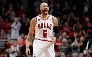 CHICAGO, IL - MAY 15:  Carlos Boozer #5 of the Chicago Bulls reacts against the Miami Heat in Game One of the Eastern Conference Finals during the 2011 NBA Playoffs on May 15, 2011 at the United Center in Chicago, Illinois. NOTE TO USER: User expressly ac