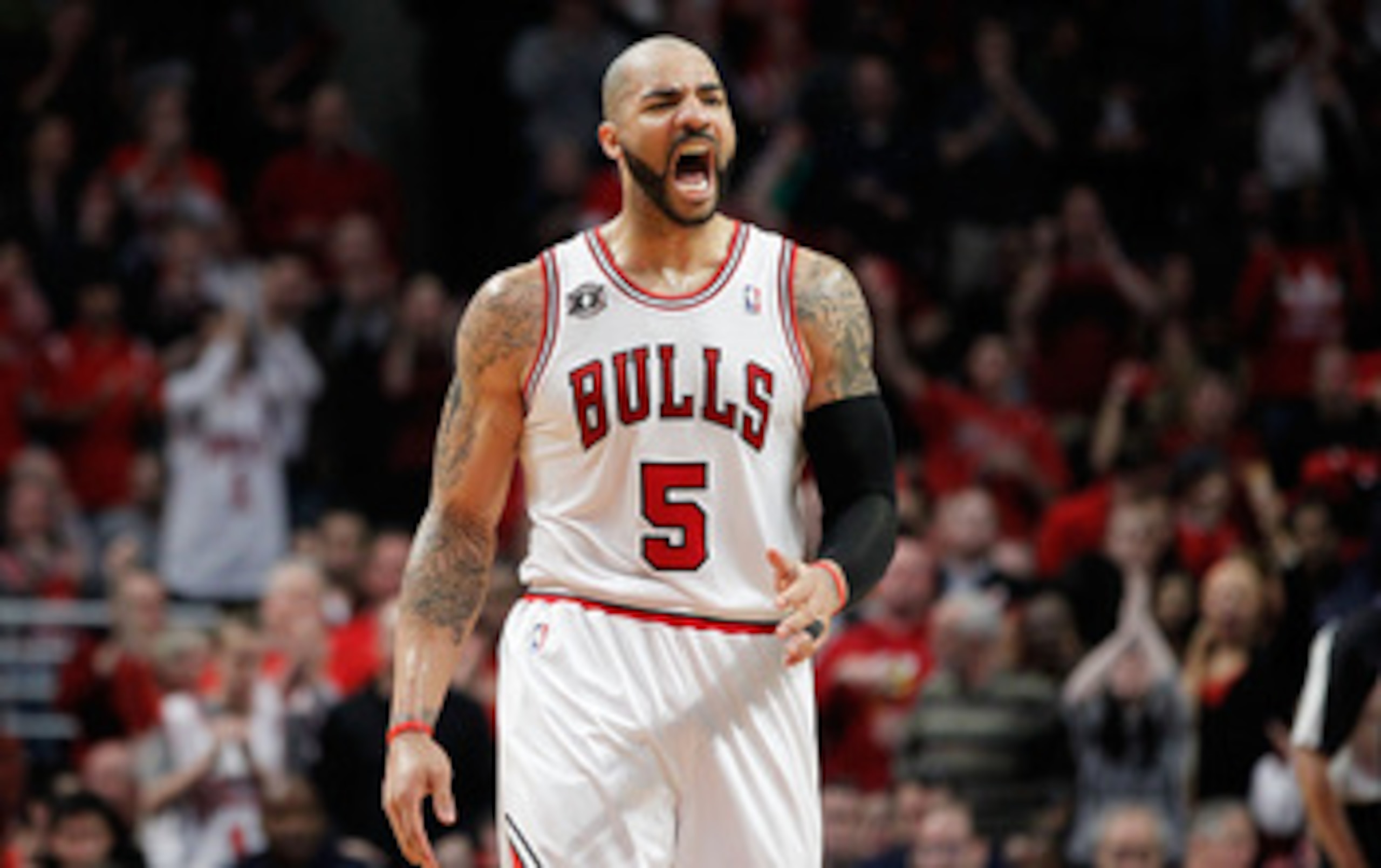 CHICAGO, IL - MAY 15:  Carlos Boozer #5 of the Chicago Bulls reacts against the Miami Heat in Game One of the Eastern Conference Finals during the 2011 NBA Playoffs on May 15, 2011 at the United Center in Chicago, Illinois. NOTE TO USER: User expressly ac