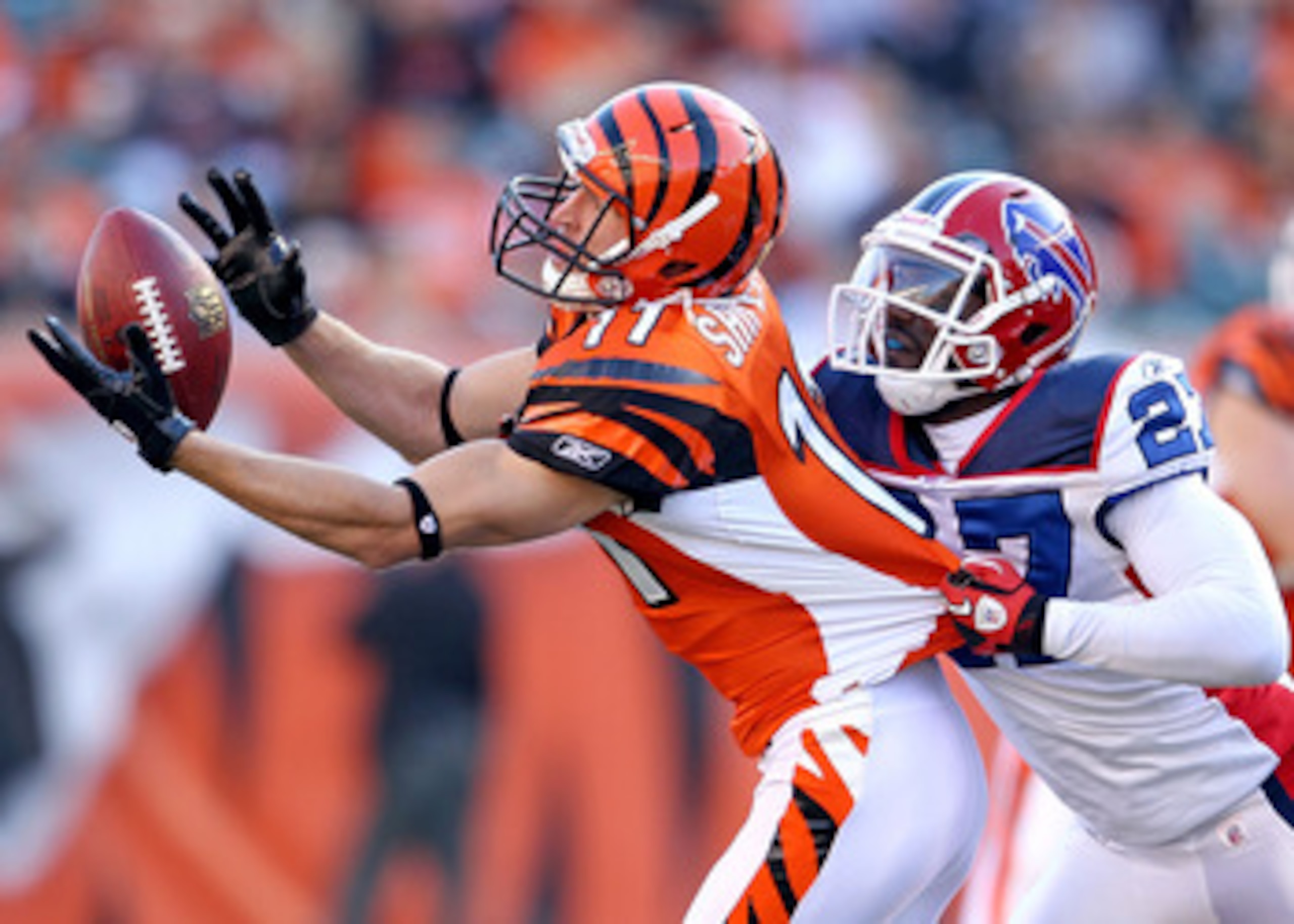 CINCINNATI - NOVEMBER 21:  Jordan Shipley #11 of the Cincinnati Bengals reaches for a pas while defended by Reggie Corner #27 of the Buffalo Bills during the NFL game  at Paul Brown Stadium on November 21, 2010 in Cincinnati, Ohio.  The Bills won 49-31.  
