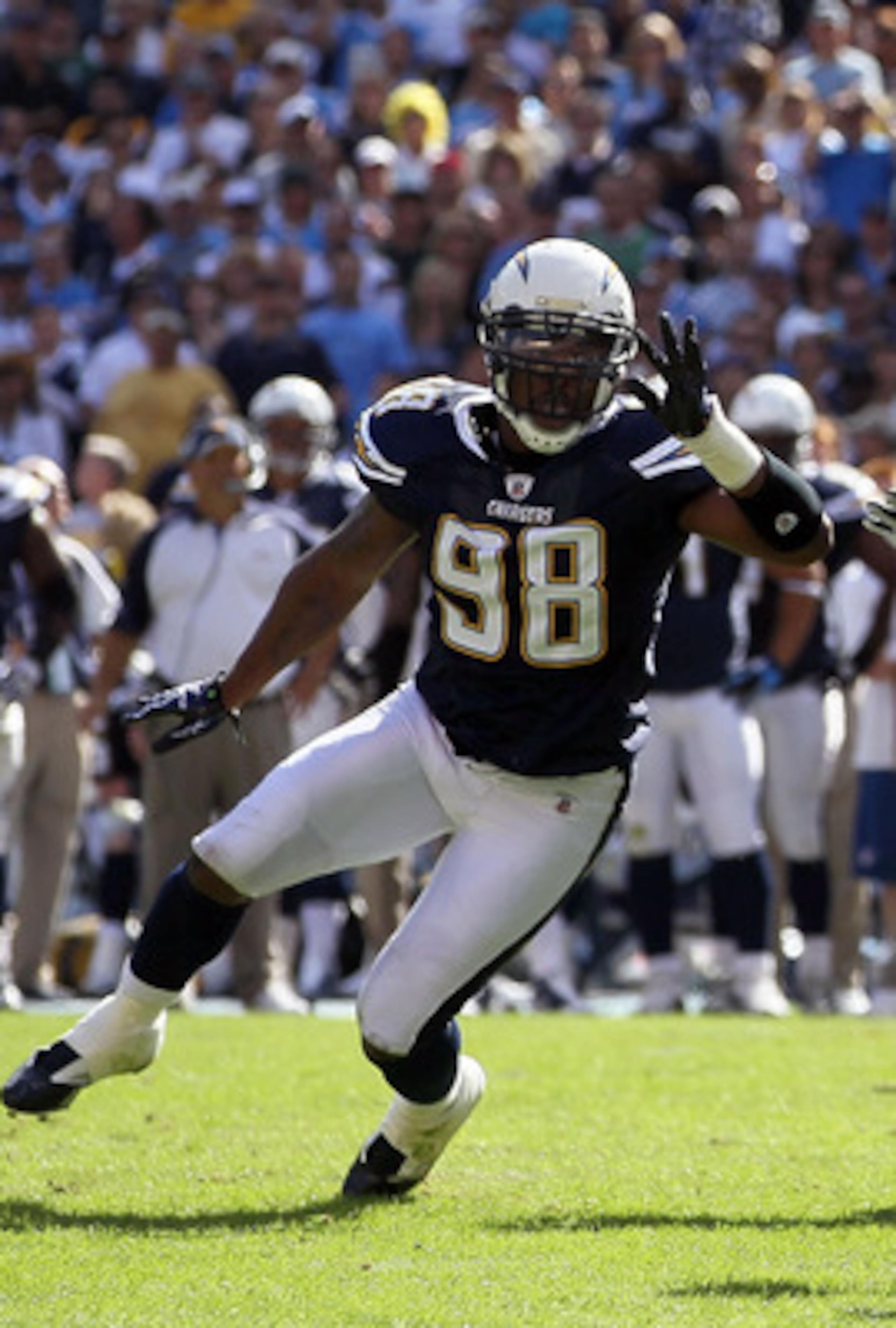 SAN DIEGO - OCTOBER 31:  Quarterback Vince Young #10 of the Tennessee Titans drops back to pass as Antwan Barnes #98 of the San Diego Chargers pressures during the game at Qualcomm Stadium on October 31, 2010 in San Diego, California. The Chargers defeate