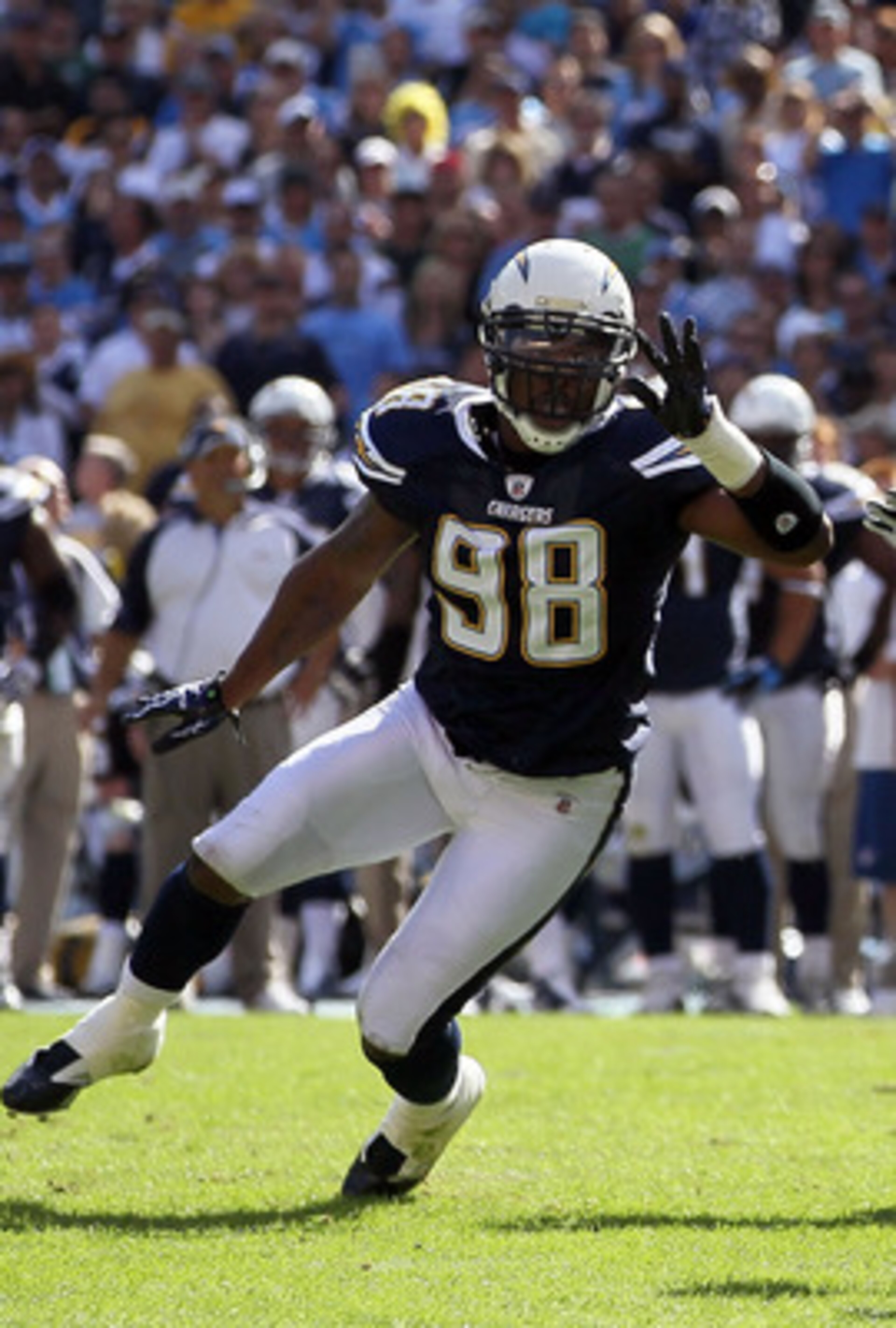 SAN DIEGO - OCTOBER 31:  Quarterback Vince Young #10 of the Tennessee Titans drops back to pass as Antwan Barnes #98 of the San Diego Chargers pressures during the game at Qualcomm Stadium on October 31, 2010 in San Diego, California. The Chargers defeate