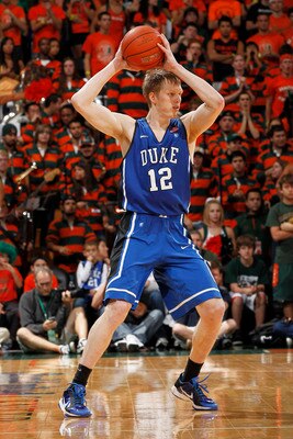 CORAL GABLES, FL - FEBRUARY 13: Kyle Singler #12 of the Duke Blue Devils passes the ball against the Miami Hurricanes on February 13, 2011 at the BankUnited Center in Coral Gables, Florida. (Photo by Joel Auerbach/Getty Images)