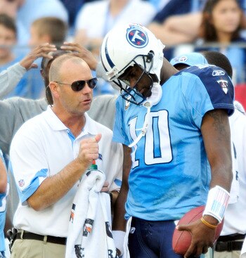 NASHVILLE, TN - NOVEMBER 21:  Quarterback Vince Young #11 of the Tennessee Titans talks with a member of the training staff after leaving a game against the Washington Redskins at LP Field on November 21, 2010 in Nashville, Tennessee. The Redskins won 19-