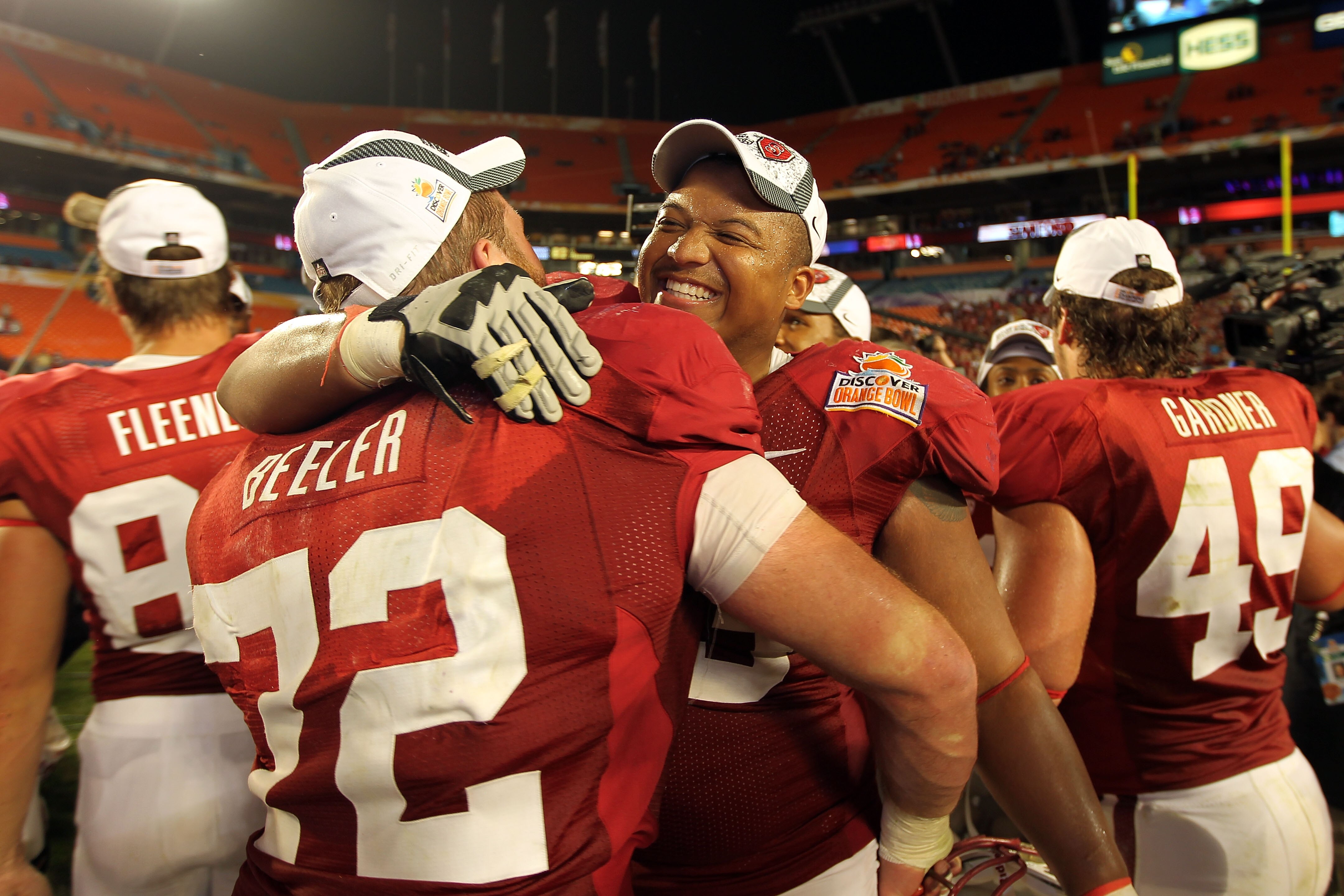 MIAMI, FL - JANUARY 03:  Derek Hall #53 and Chase Beeler #72 of the Stanford Cardinal celebrate after Stanford won 40-12 against the Virginia Tech Hokies during the 2011 Discover Orange Bowl at Sun Life Stadium on January 3, 2011 in Miami, Florida.  (Phot