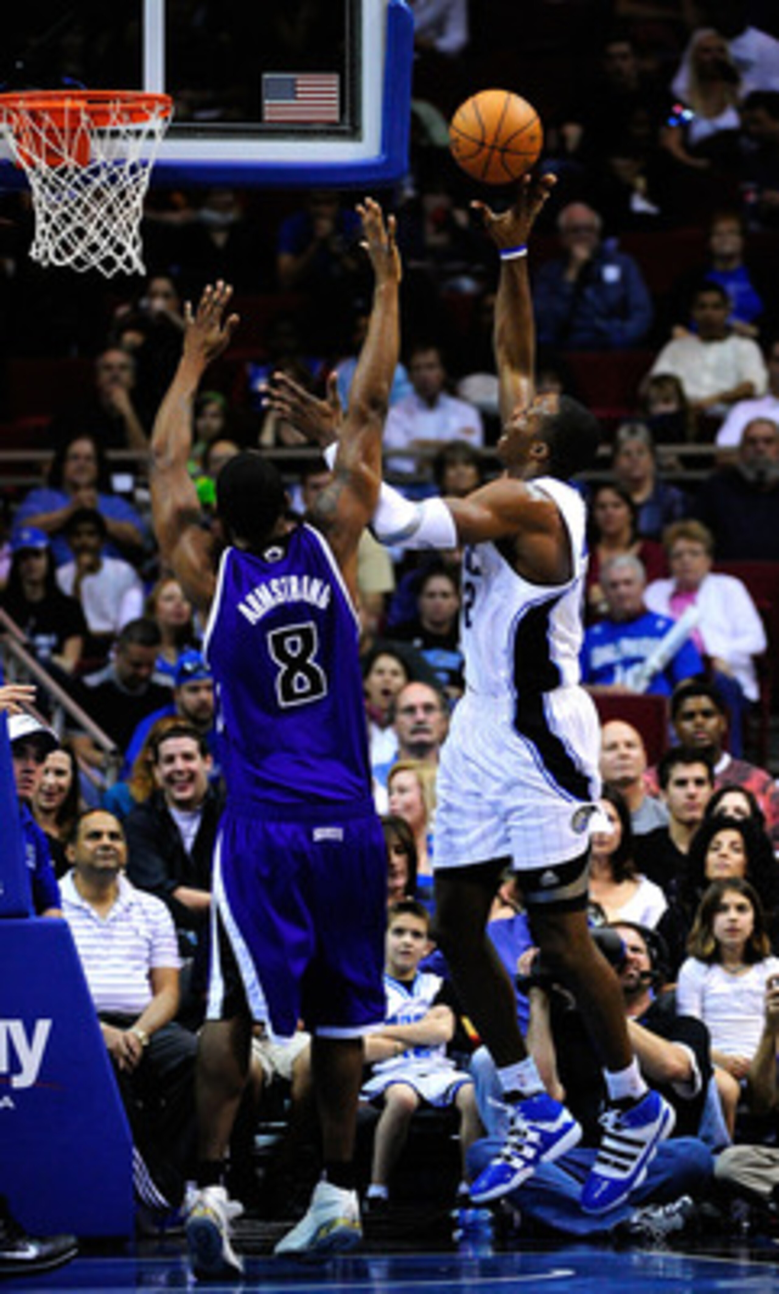 ORLANDO, FL - JANUARY 22:  Dwight Howard #12 of the Orlando Magic attempts a shot against Hilton Armstrong #8 of the Sacramento Kings during the game at Amway Arena on January 22, 2010 in Orlando, Florida. NOTE TO USER: User expressly acknowledges and agr