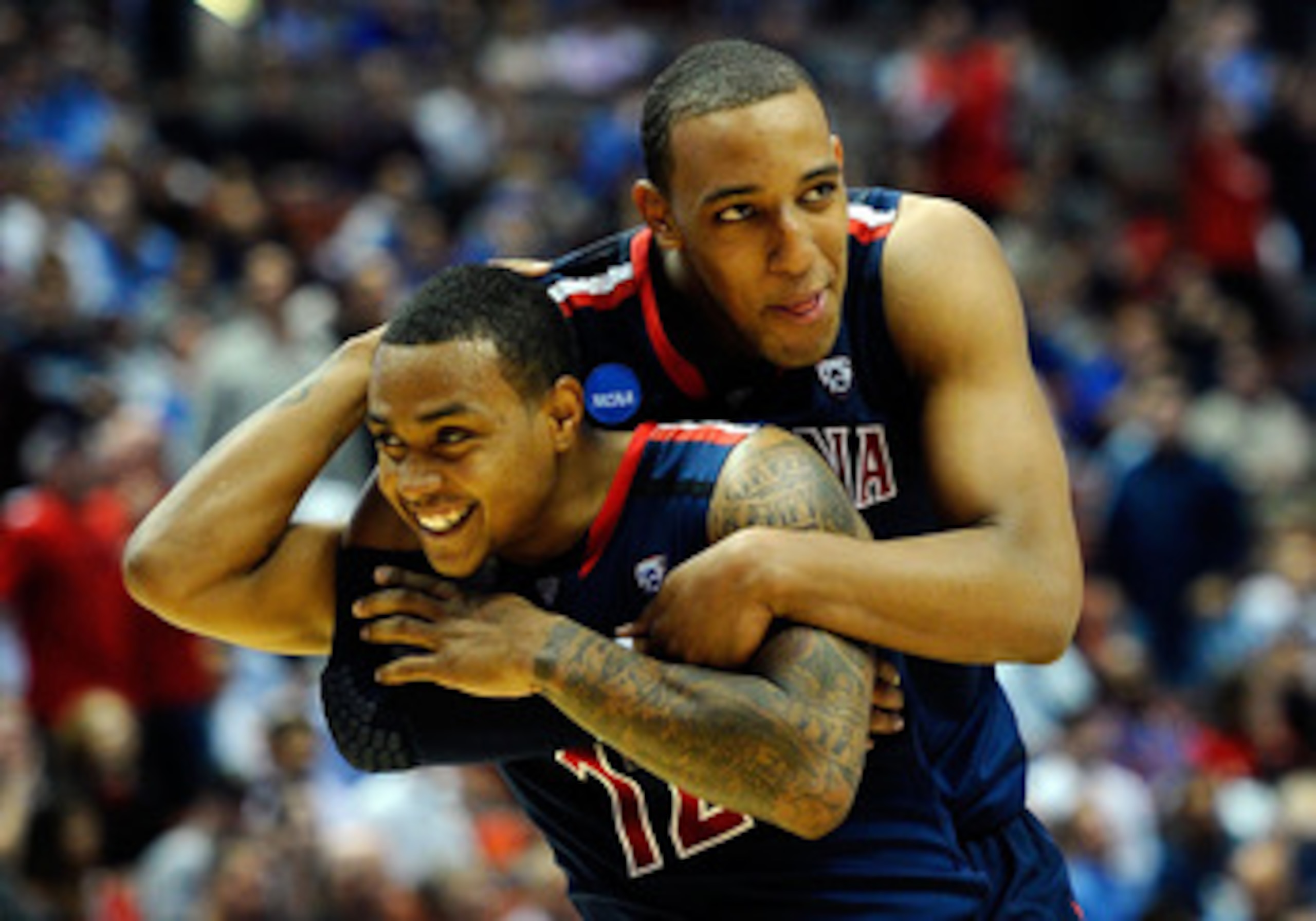 ANAHEIM, CA - MARCH 24: Lamont Jones #12 and Derrick Williams #23 of the Arizona Wildcats reacts after a play against the Duke Blue Devils during the west regional semifinal of the 2011 NCAA men's basketball tournament at the Honda Center on March 24, 20 ANAHEIM, CA - MARCH 24: Lamont Jones #12 and Derrick Williams #23 of the Arizona Wildcats reacts after a play against the Duke Blue Devils during the west regional semifinal of the 2011 NCAA men's basketball tournament at the Honda Center on March 24, 20