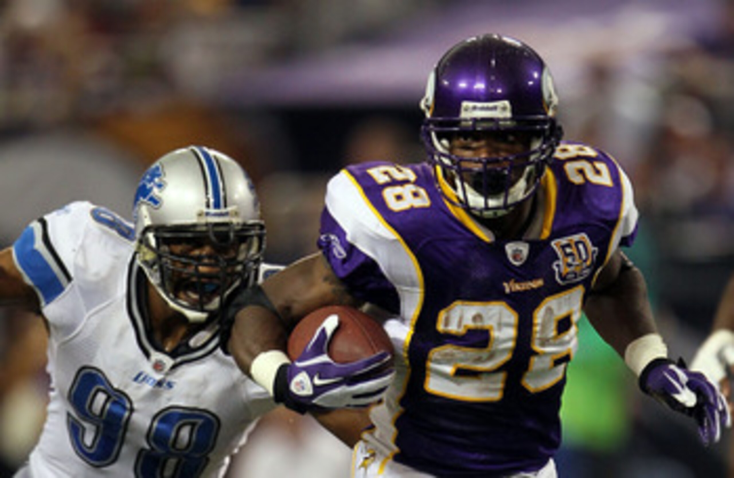 MINNEAPOLIS - SEPTEMBER 26:  Running back Adrian Peterson #28 of the Minnesota Vikings carries the ball against the Detroit Lions at Mall of America Field on September 26, 2010 in Minneapolis, Minnesota. The Vikings defeated the Lions 24-10.  (Photo by Je