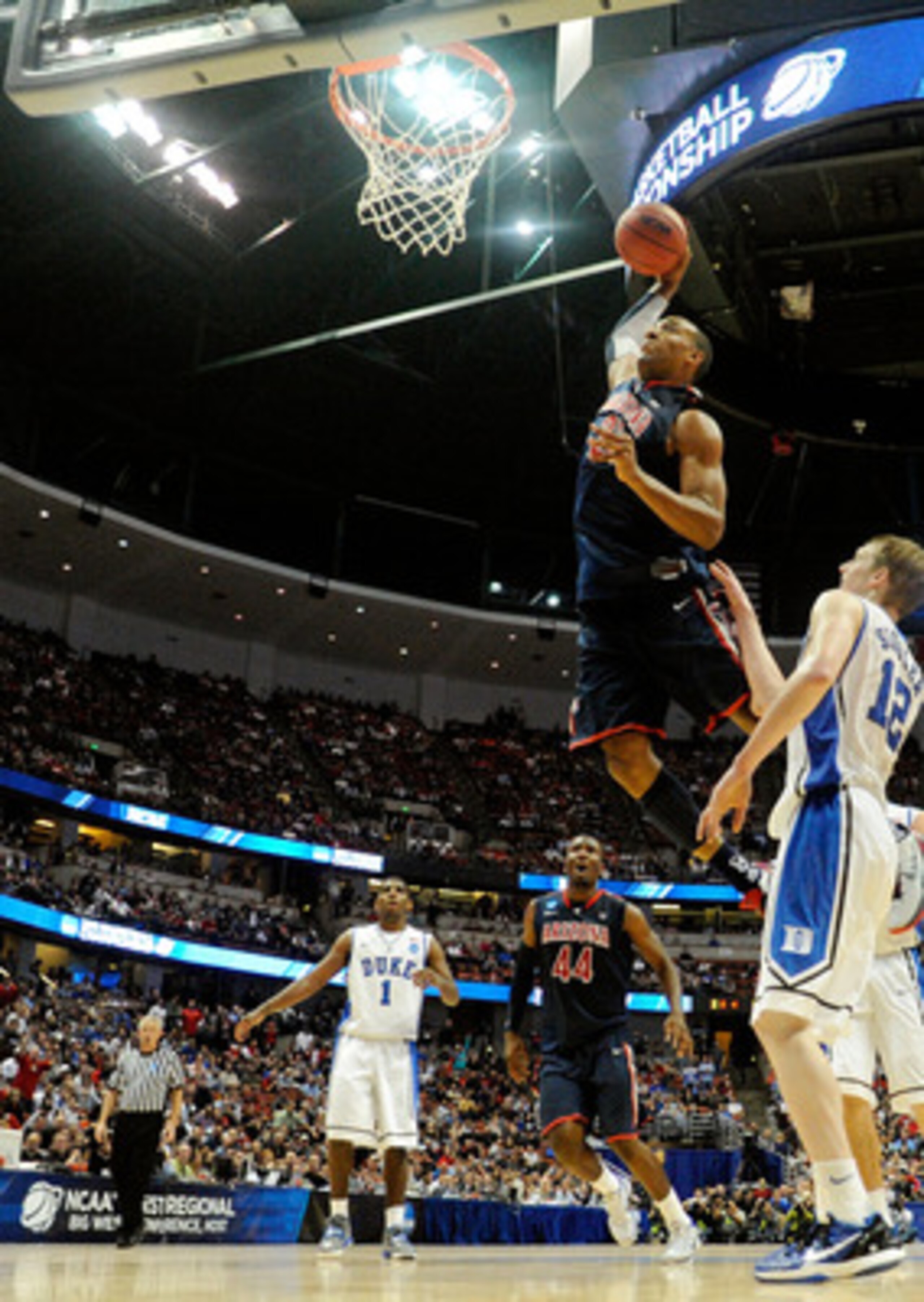 ANAHEIM, CA - MARCH 24: Derrick Williams #23 of the Arizona Wildcats dunks the over Kyle Singler #12 of the Duke Blue Devils during the west regional semifinal of the 2011 NCAA men's basketball tournament at the Honda Center on March 24, 2011 in Anaheim, ANAHEIM, CA - MARCH 24: Derrick Williams #23 of the Arizona Wildcats dunks the over Kyle Singler #12 of the Duke Blue Devils during the west regional semifinal of the 2011 NCAA men's basketball tournament at the Honda Center on March 24, 2011 in Anaheim,