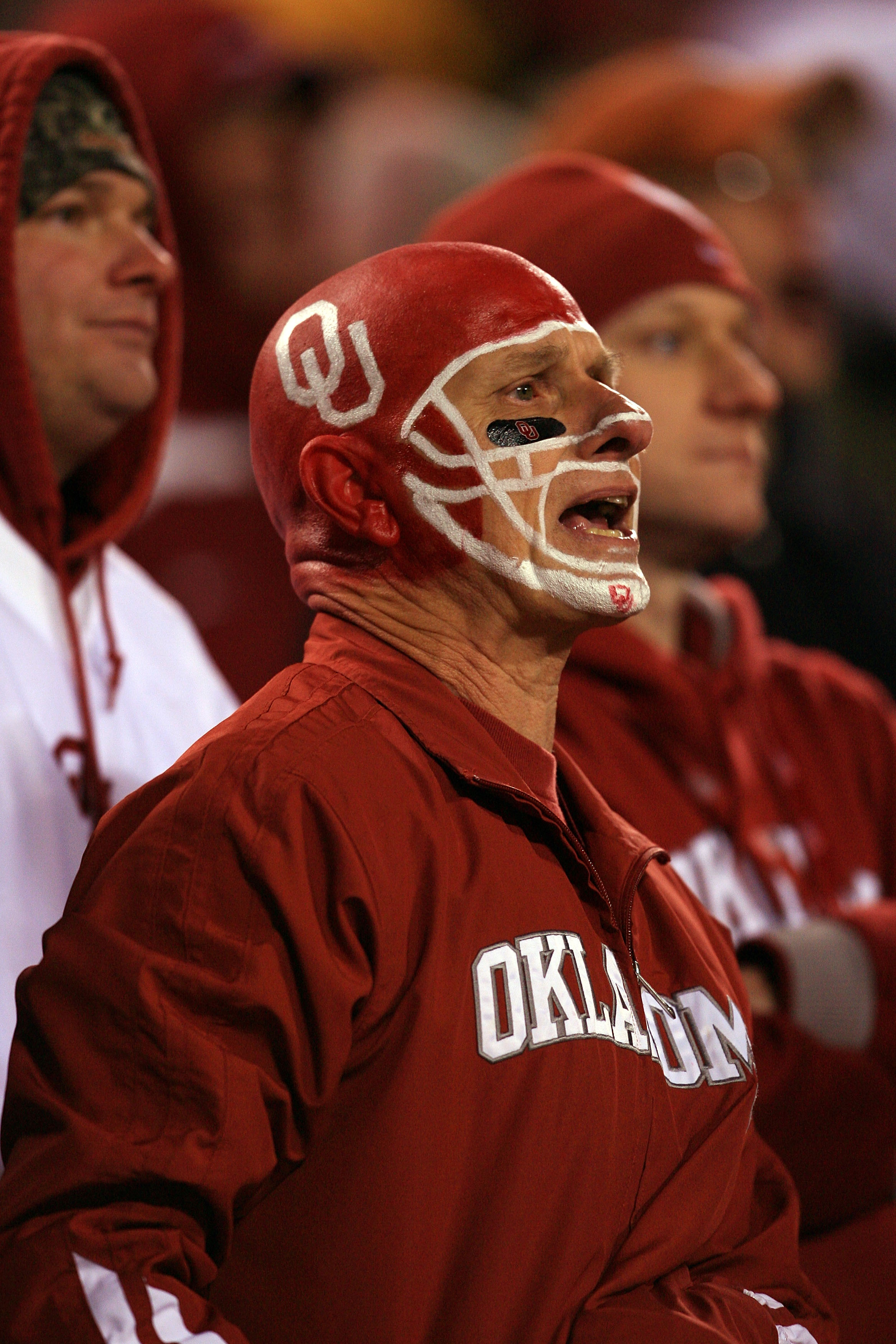 KANSAS CITY, MO - DECEMBER 06:  An Oklahoma Sooners fan cheers during the Big 12 Championship game against the Missouri Tigers on December 6, 2008 at Arrowhead Stadium in Kansas City, Missouri.  (Photo by Jamie Squire/Getty Images)