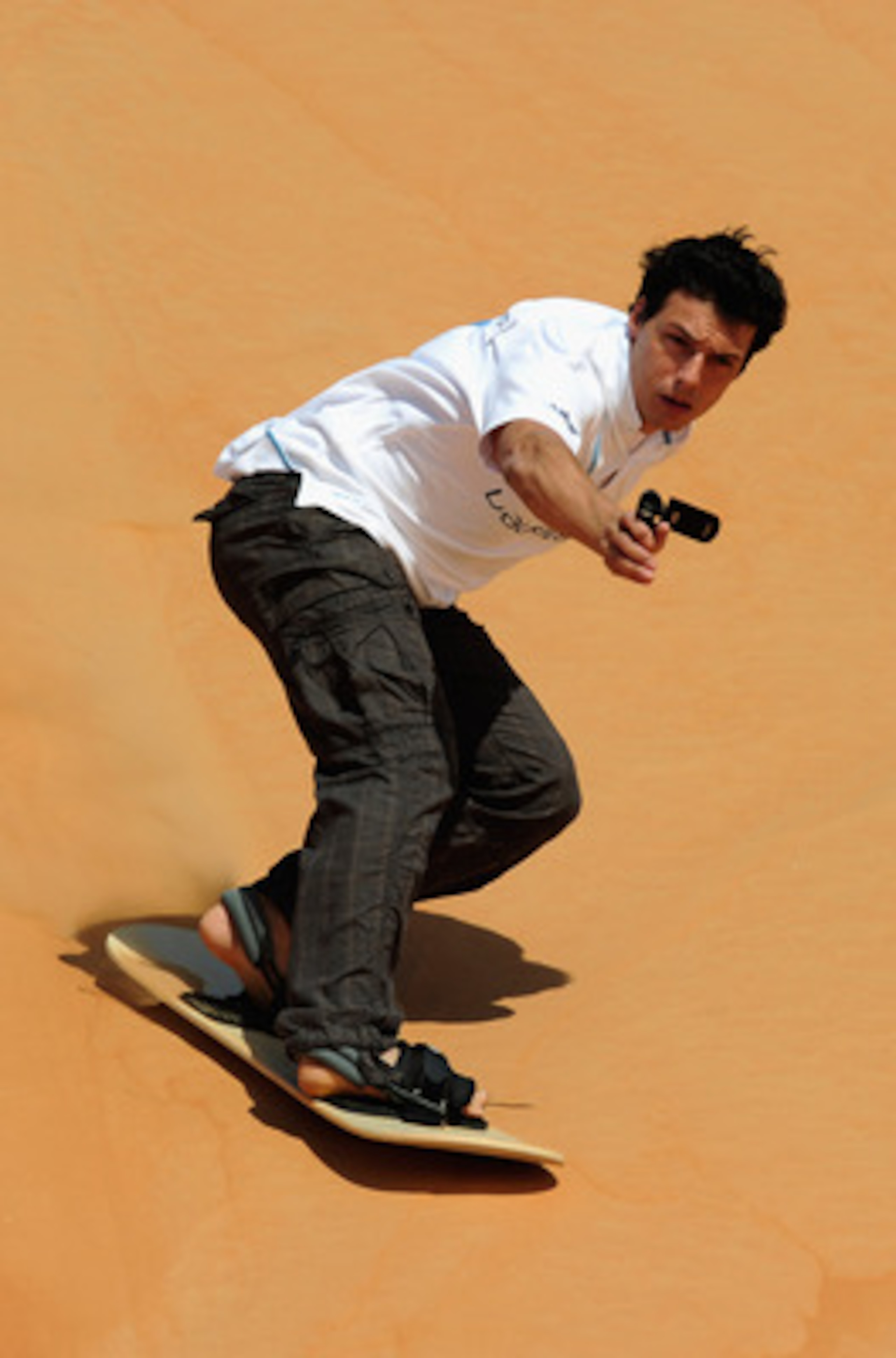 ABU DHABI, UNITED ARAB EMIRATES - FEBRUARY 05:  Taig Khris during the Laureus Sandboarding Experience as part of the 2011 Laureus World Sports Awards in the Liwa Desert, Rub Al Khali (Empty Quarter) on February 5, 2011 in Abu Dhabi, United Arab Emirates. 