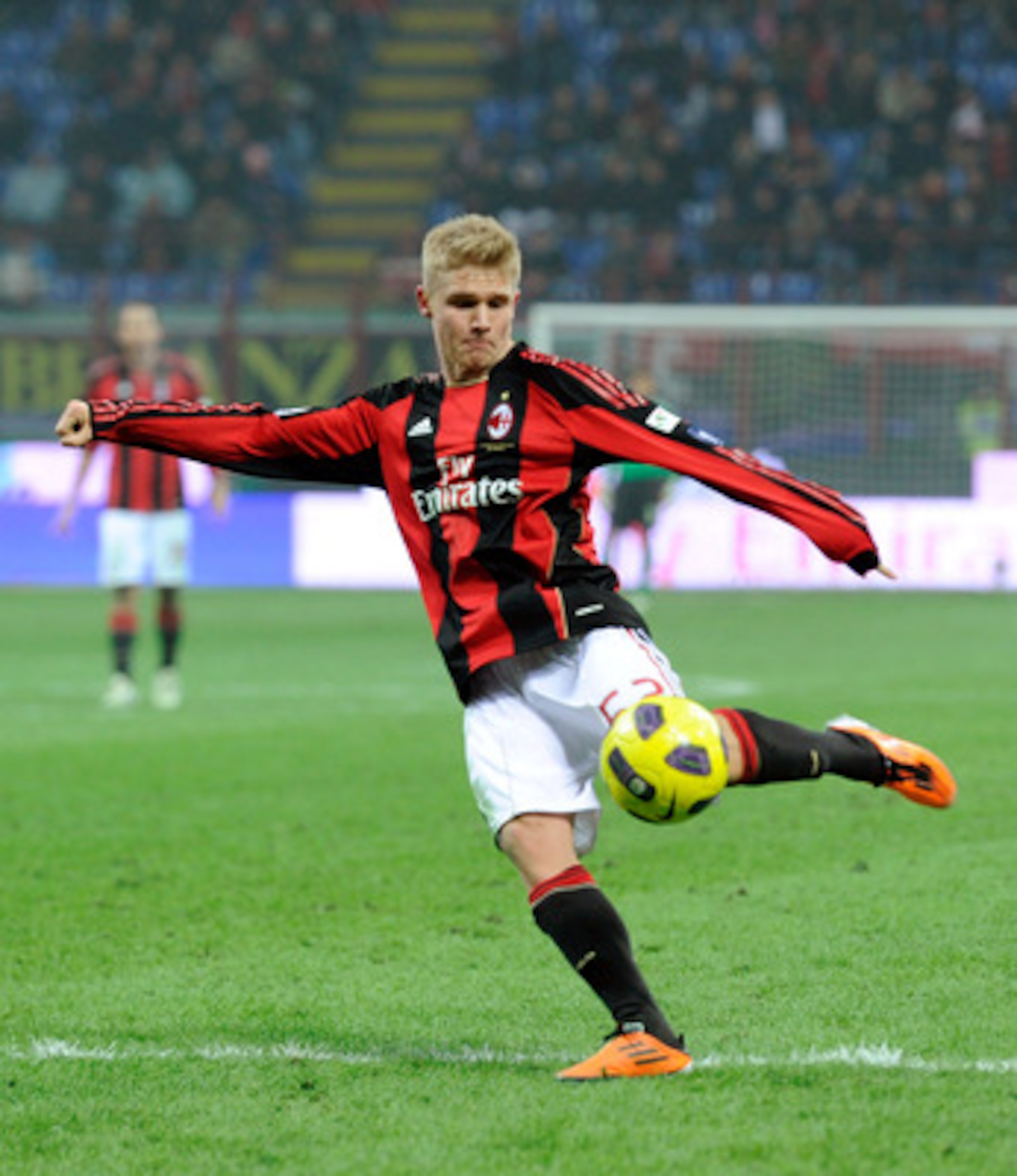 MILAN, ITALY - JANUARY 20:  Alexander Merkel of AC Milan goes for the ball during the Tim Cup match between Milan and Bari at Giuseppe Meazza Stadium on January 20, 2011 in Milan, Italy.  (Photo by Claudio Villa/Getty Images)