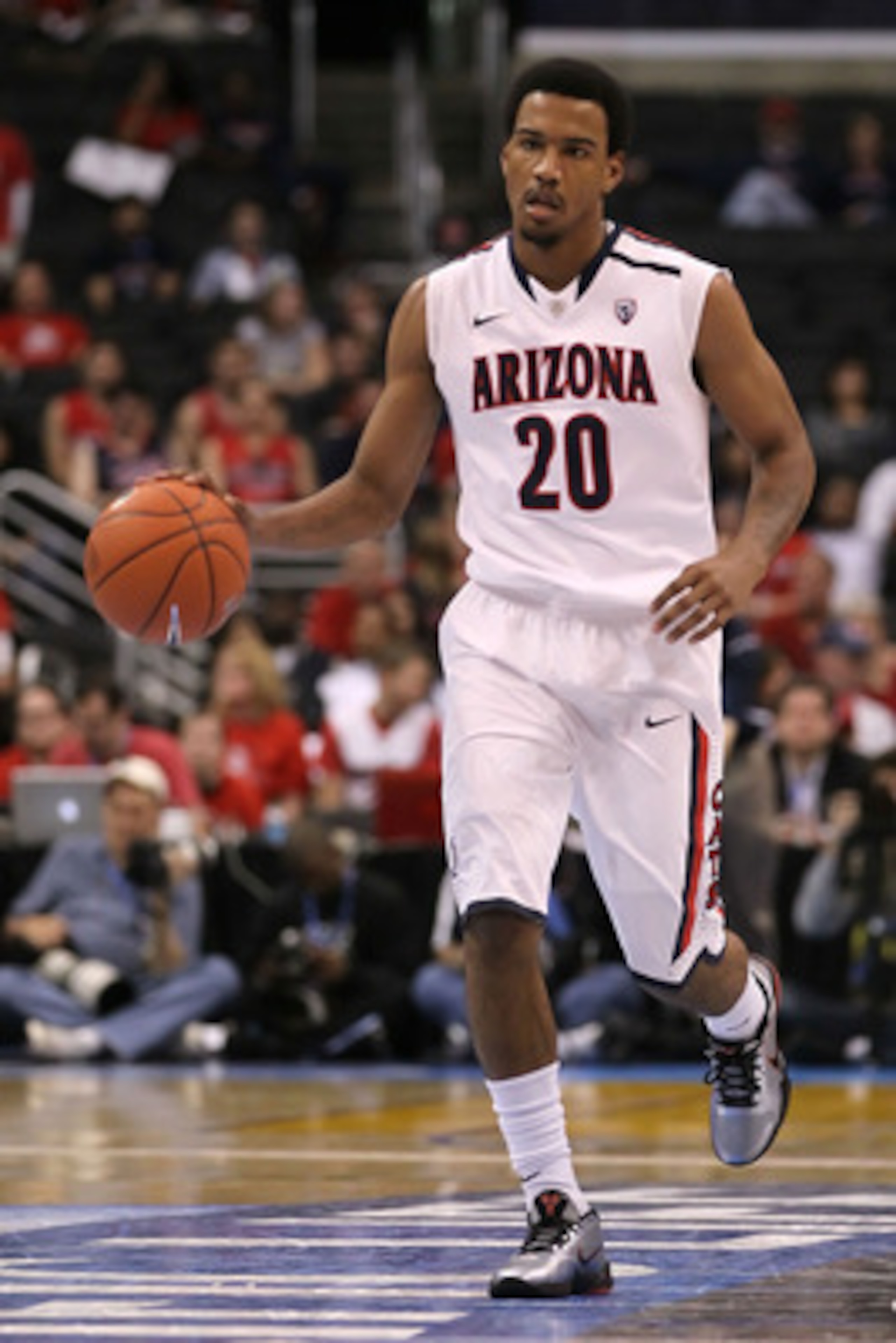 LOS ANGELES, CA - MARCH 12: Jordin Mayes #20 of the Arizona Wildcats moves the ball while taking on the Washington Huskies in the championship game of the 2011 Pacific Life Pac-10 Men's Basketball Tournament at Staples Center on March 12, 2011 in Los Ang LOS ANGELES, CA - MARCH 12: Jordin Mayes #20 of the Arizona Wildcats moves the ball while taking on the Washington Huskies in the championship game of the 2011 Pacific Life Pac-10 Men's Basketball Tournament at Staples Center on March 12, 2011 in Los Ang